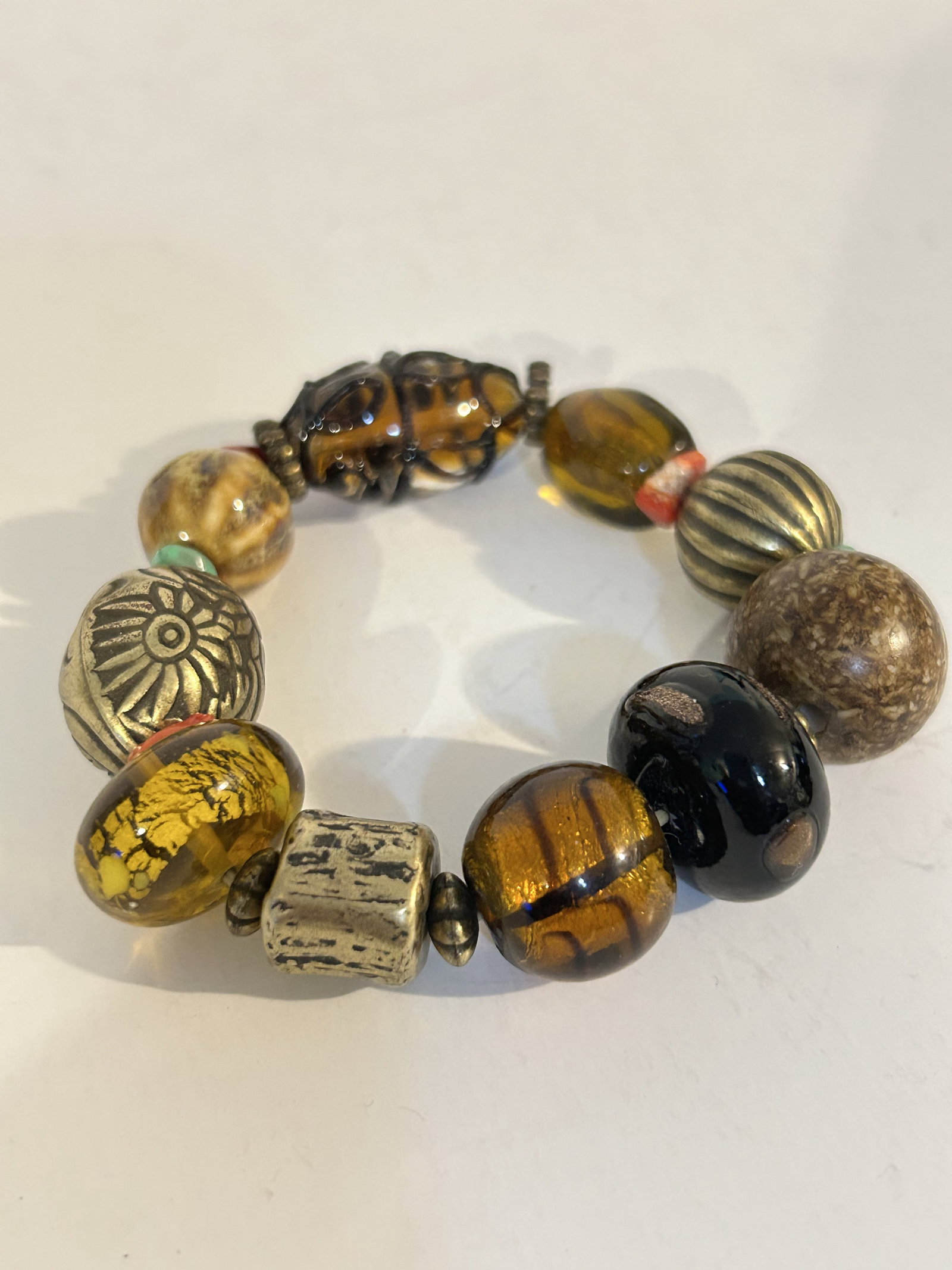 Vintage murano brass beaded stretch Bracelet: Vintage murano brass beaded stretch Bracelet Please view all photos as they are part of the description and condition of this Item, Feel free to contact me with questions or picture requests! Used Ite