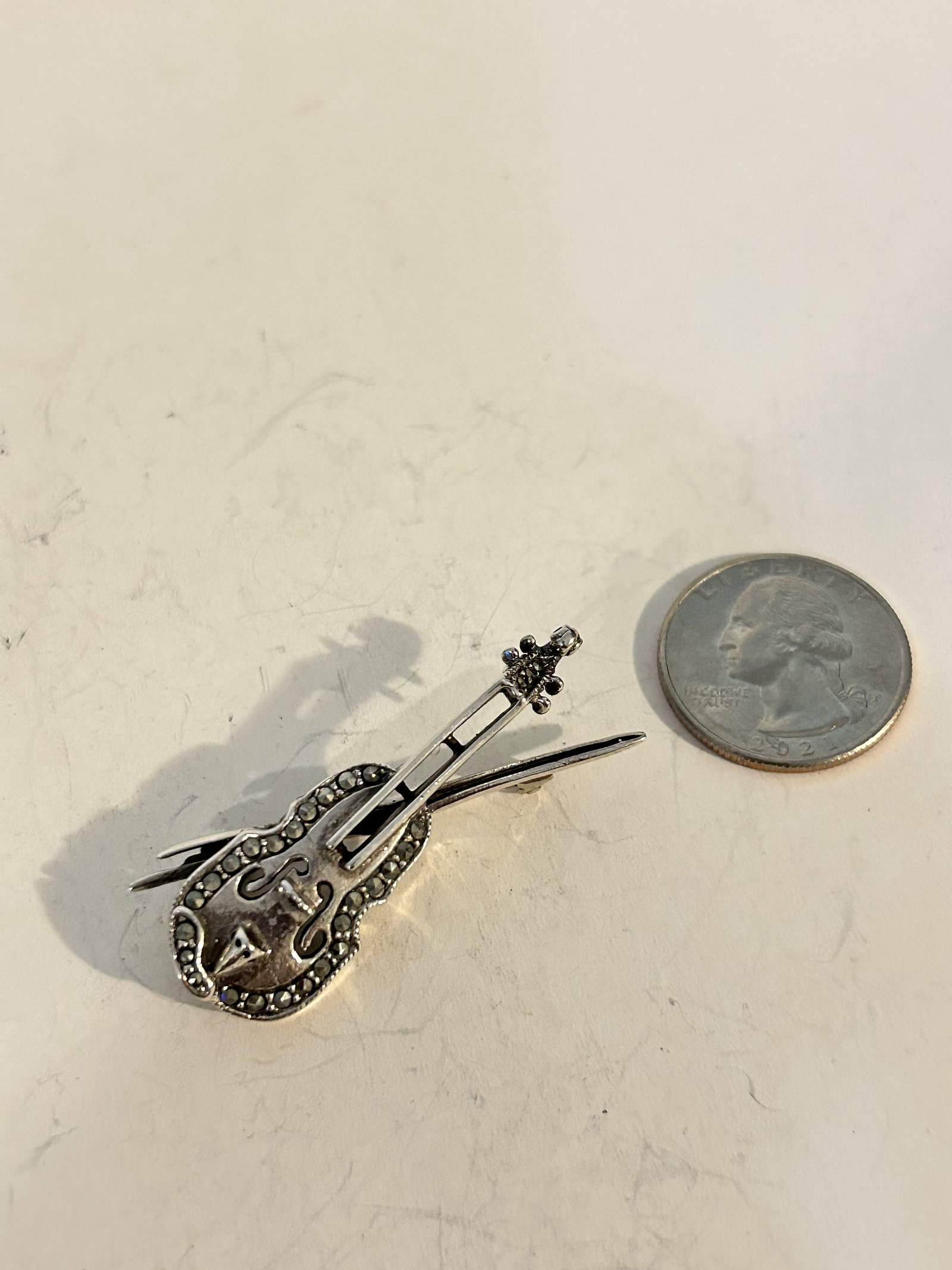 Vintage Sterling Silver guitar marcasite Brooch well made: Vintage Sterling Silver guitar marcasite Brooch well made Please view all photos as they are part of the description and condition of this Item, Feel free to contact me with questions or picture reque
