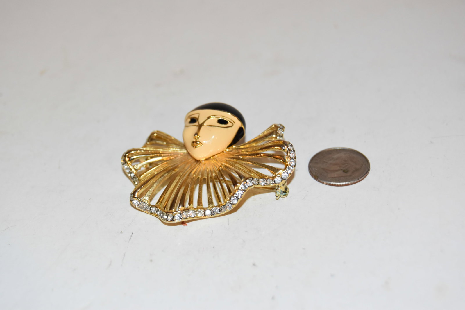 Vintage gold tone enamel rhinestone lady Brooch missing a couple stones: Vintage gold tone enamel rhinestone lady Brooch missing a couple stones Please view all photos as they are part of the description and condition of this Item, Feel free to contact me with questions or