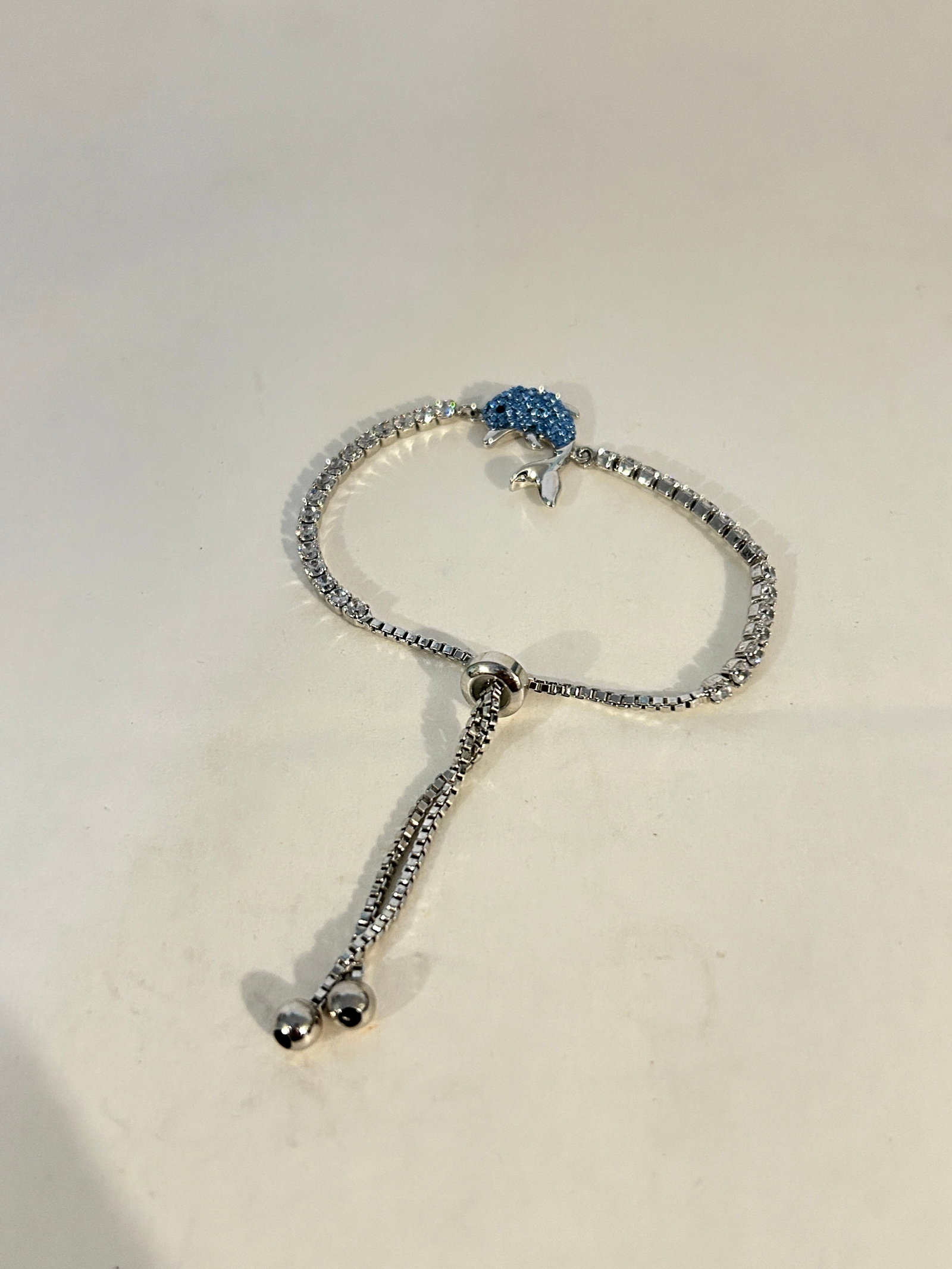 Vintage dolphin blue rhinestone adjustable Bracelet: Vintage dolphin blue rhinestone adjustable Bracelet Please view all photos as they are part of the description and condition of this Item, Feel free to contact me with questions or picture requests! U