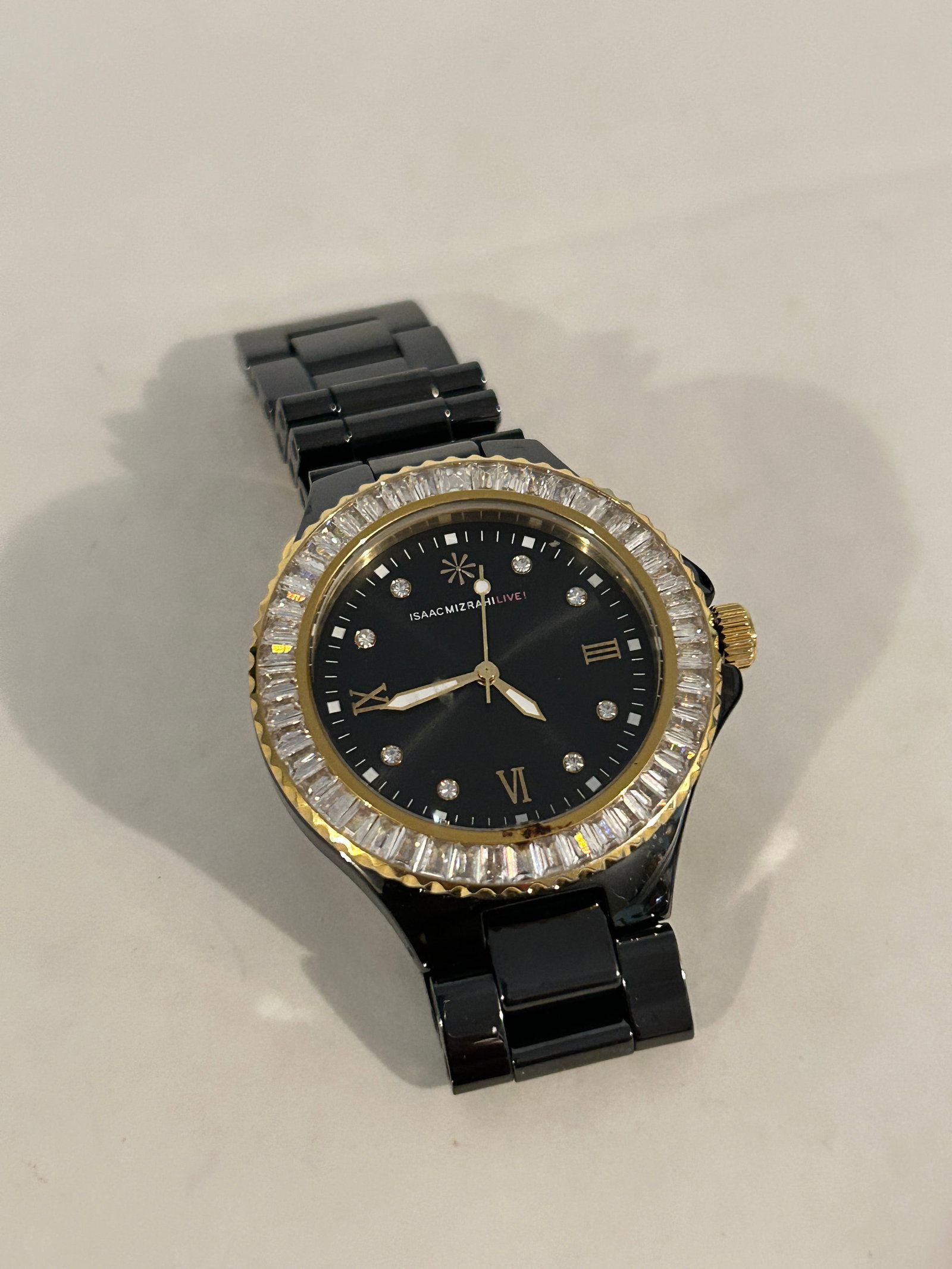 Isaac Mizrahi Live enamel rhinestone Watch 36mm Working: Isaac Mizrahi Live enamel rhinestone Watch 36mm Working Please view all photos as they are part of the description and condition of this Item, Feel free to contact me with questions or picture request