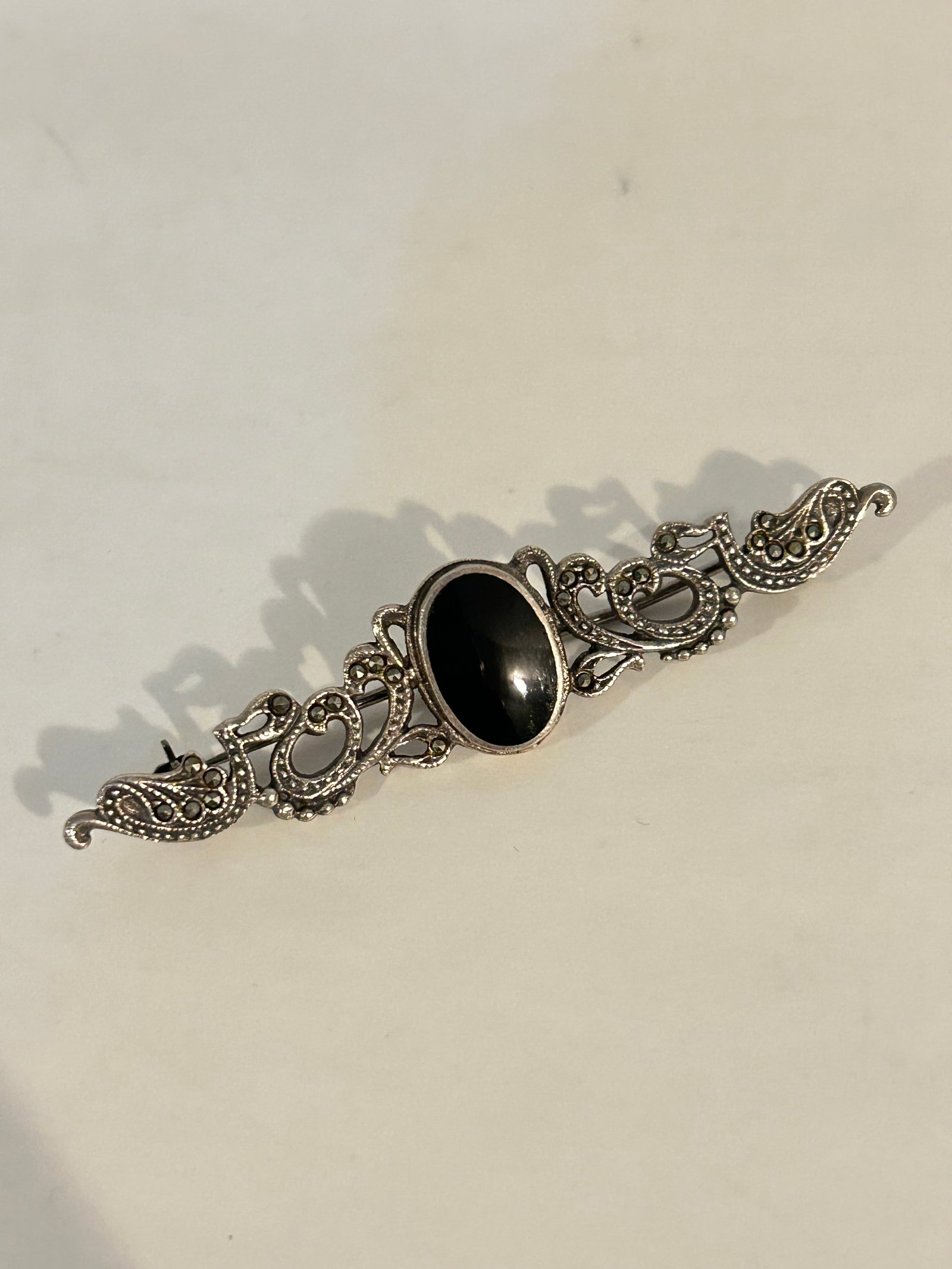 Vintage Sterling Silver marcasite onyx Brooch: Vintage Sterling Silver marcasite onyx Brooch Please view all photos as they are part of the description and condition of this Item, Feel free to contact me with questions or picture requests! Used It