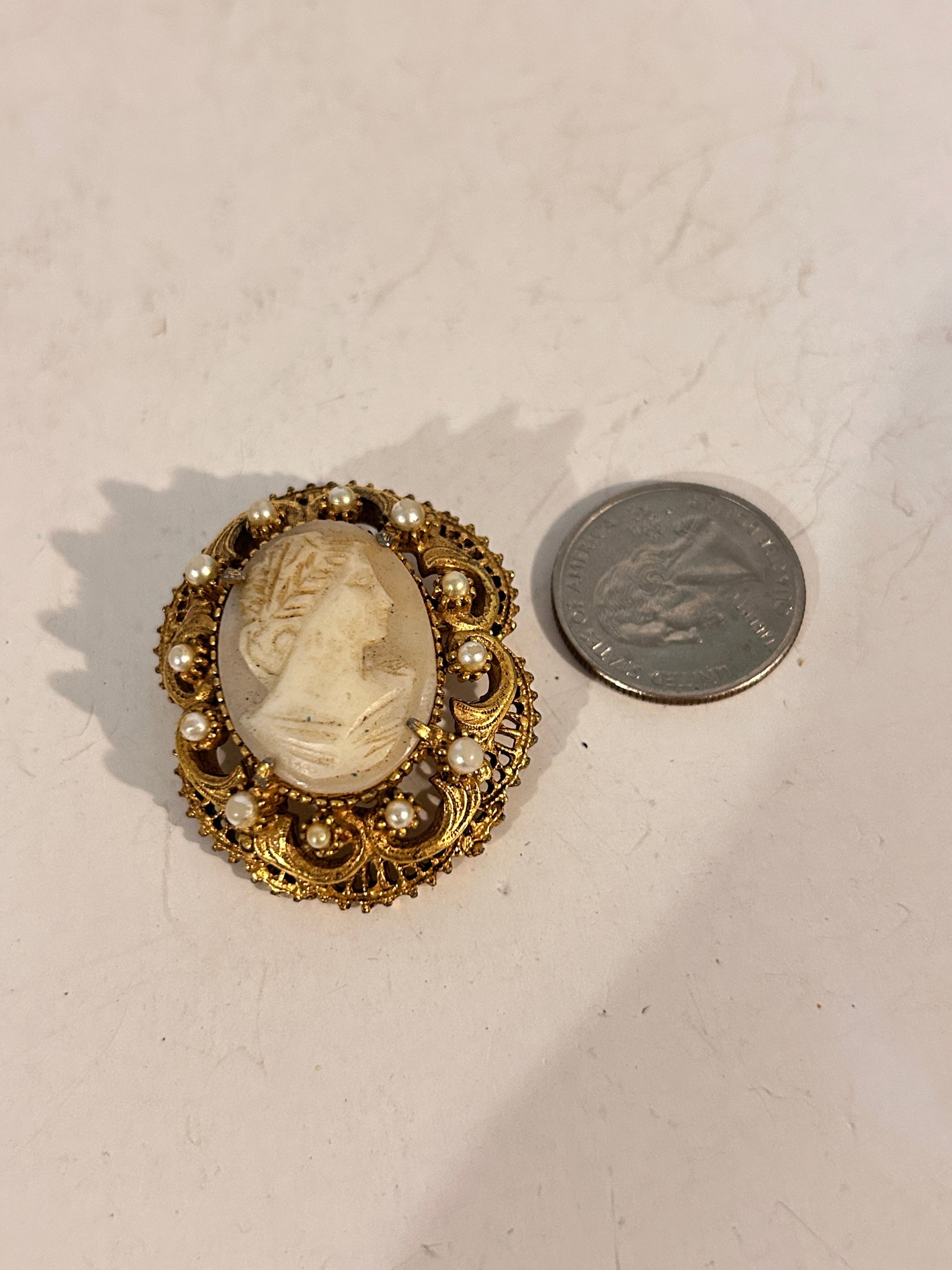Vintage gold tone pearl Florenza cameo Brooch: Vintage gold tone pearl Florenza cameo Brooch Please view all photos as they are part of the description and condition of this Item, Feel free to contact me with questions or picture requests! Used It