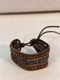 Vintage beaded cloth Bracelet sz 7" small tear in it