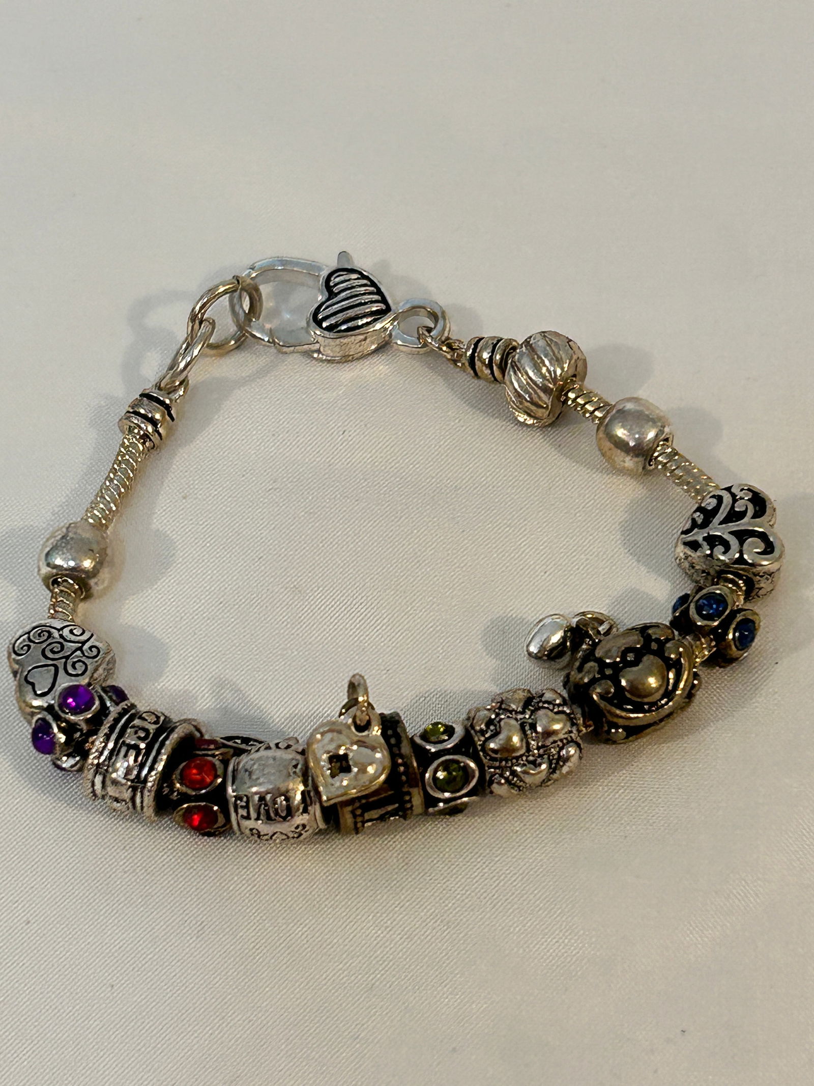 Brighton Charming Bangle Charms and Beads Bracelet 8": Brighton Charming Bangle Charms and Beads Bracelet 8" Please view all photos as they are part of the description and condition of this Item, Feel free to contact me with questions or picture requests!