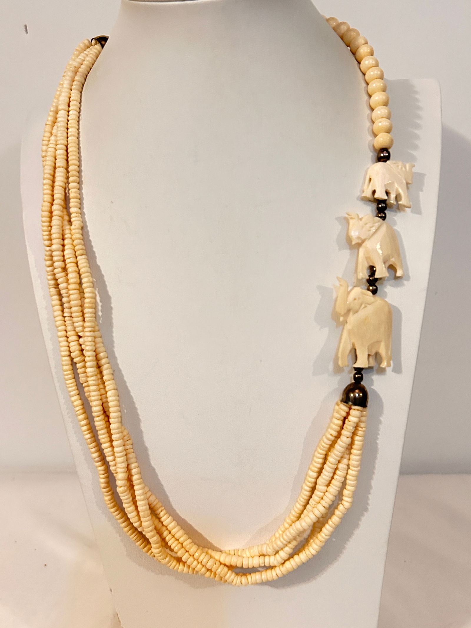 Vintage 5 strand white bead elephant Necklace 25": Vintage 5 strand white bead elephant Necklace 25" Please view all photos as they are part of the description and condition of this Item, Feel free to contact me with questions or picture requests! Use
