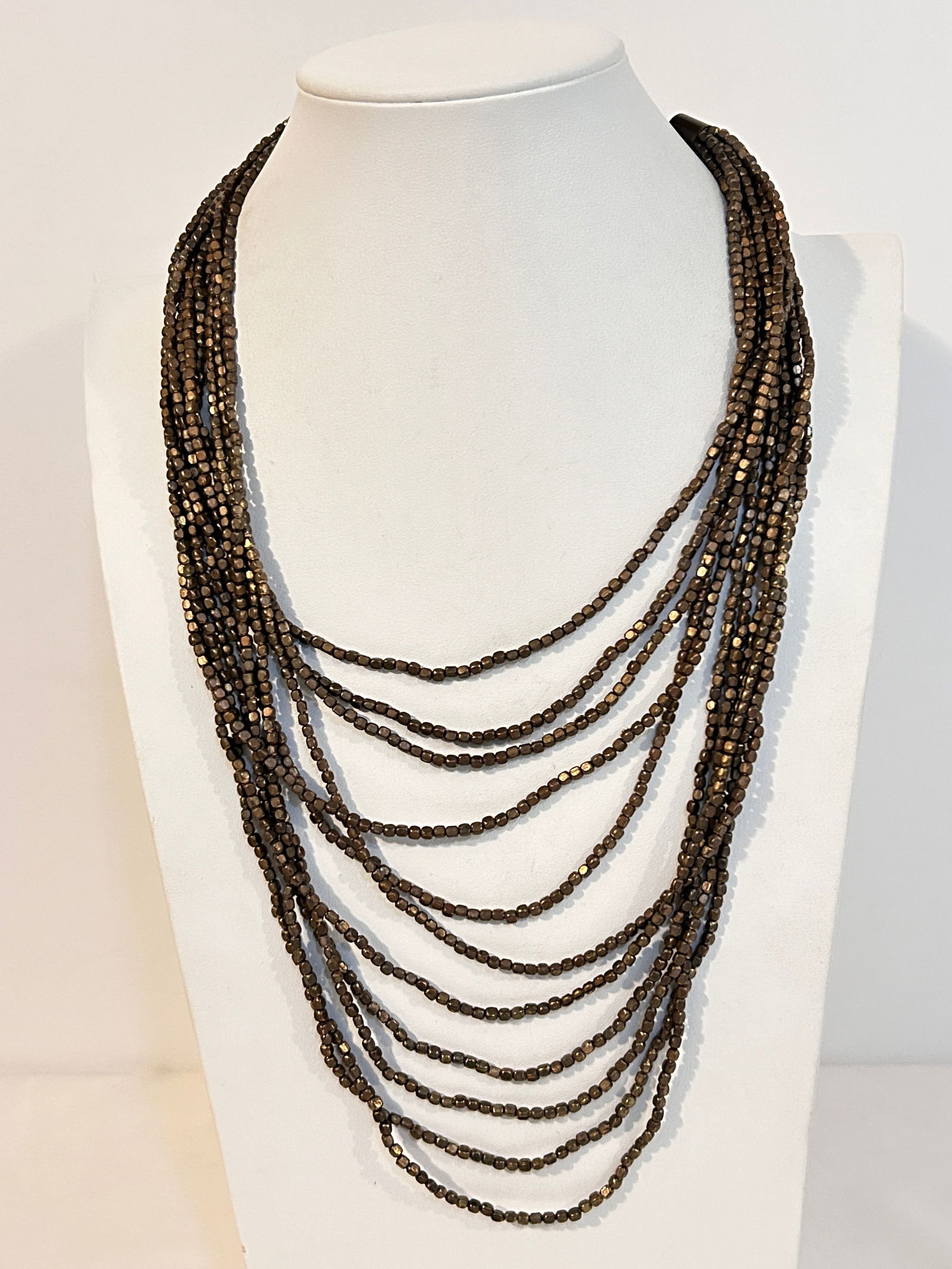 Vintage Brass Copper bead 11 strand Necklace 19": Vintage Brass Copper bead 11 strand Necklace 19" Please view all photos as they are part of the description and condition of this Item, Feel free to contact me with questions or picture requests! Used