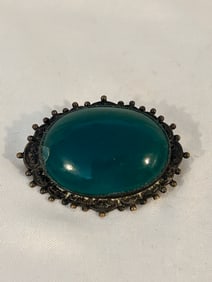 Vintage 1800s Green glass Brooch has a small chip