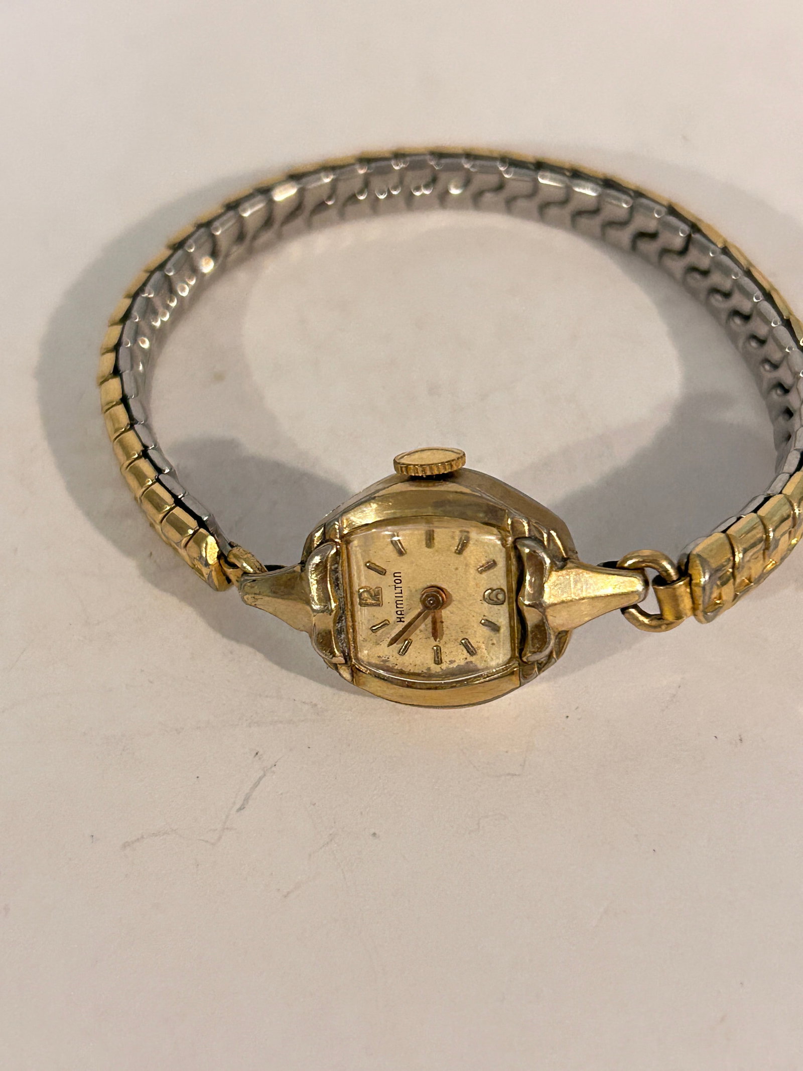 Vintage Hamilton 10K Gold-Filled Women's Watch w/ Flexible Band working: Vintage Hamilton 10K Gold-Filled Women's Watch w/ Flexible Band working Please view all photos as they are part of the description and condition of this Item, Feel free to contact me with questions or