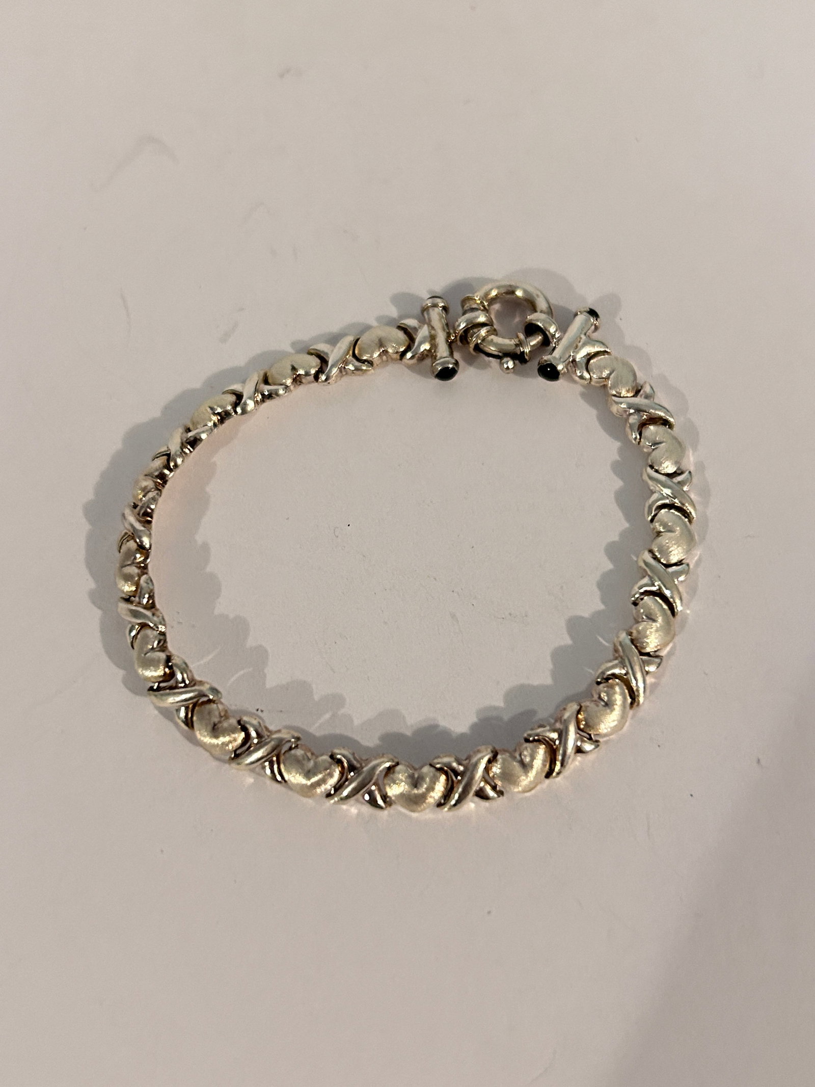 Vintage Sterling Silver Star Gold XOXO Bracelet 7": Vintage Sterling Silver Star Gold XOXO Bracelet 7" Please view all photos as they are part of the description and condition of this Item, Feel free to contact me with questions or picture requests! Us