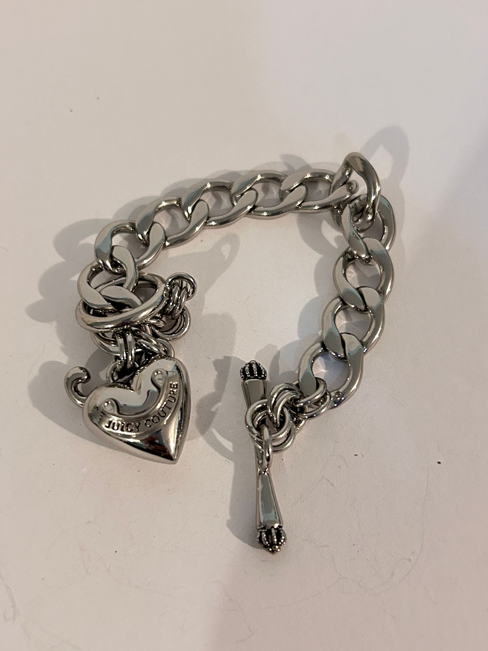Vintage heavy Juicy Couture heart Bracelet 7": Vintage heavy Juicy Couture heart Bracelet 7" Please view all photos as they are part of the description and condition of this Item, Feel free to contact me with questions or picture requests! Used It
