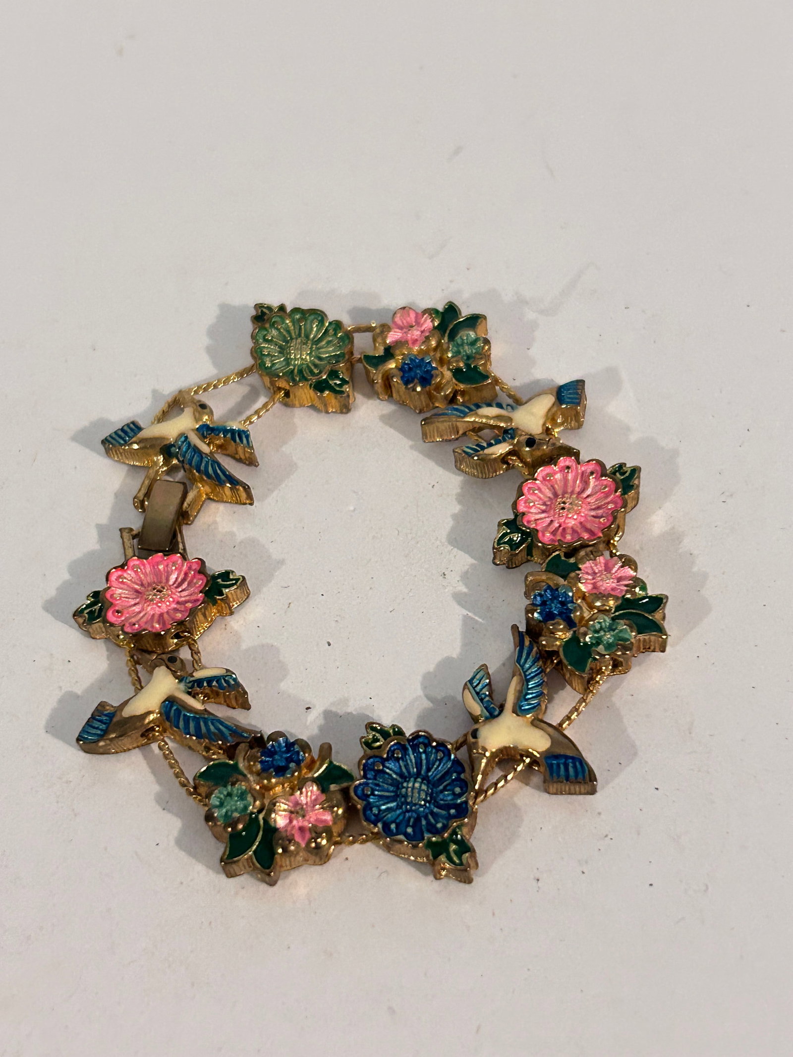 Vintage gold tone enamel floral bird Bracelet 7": Vintage gold tone enamel floral bird Bracelet 7" Please view all photos as they are part of the description and condition of this Item, Feel free to contact me with questions or picture requests! Used