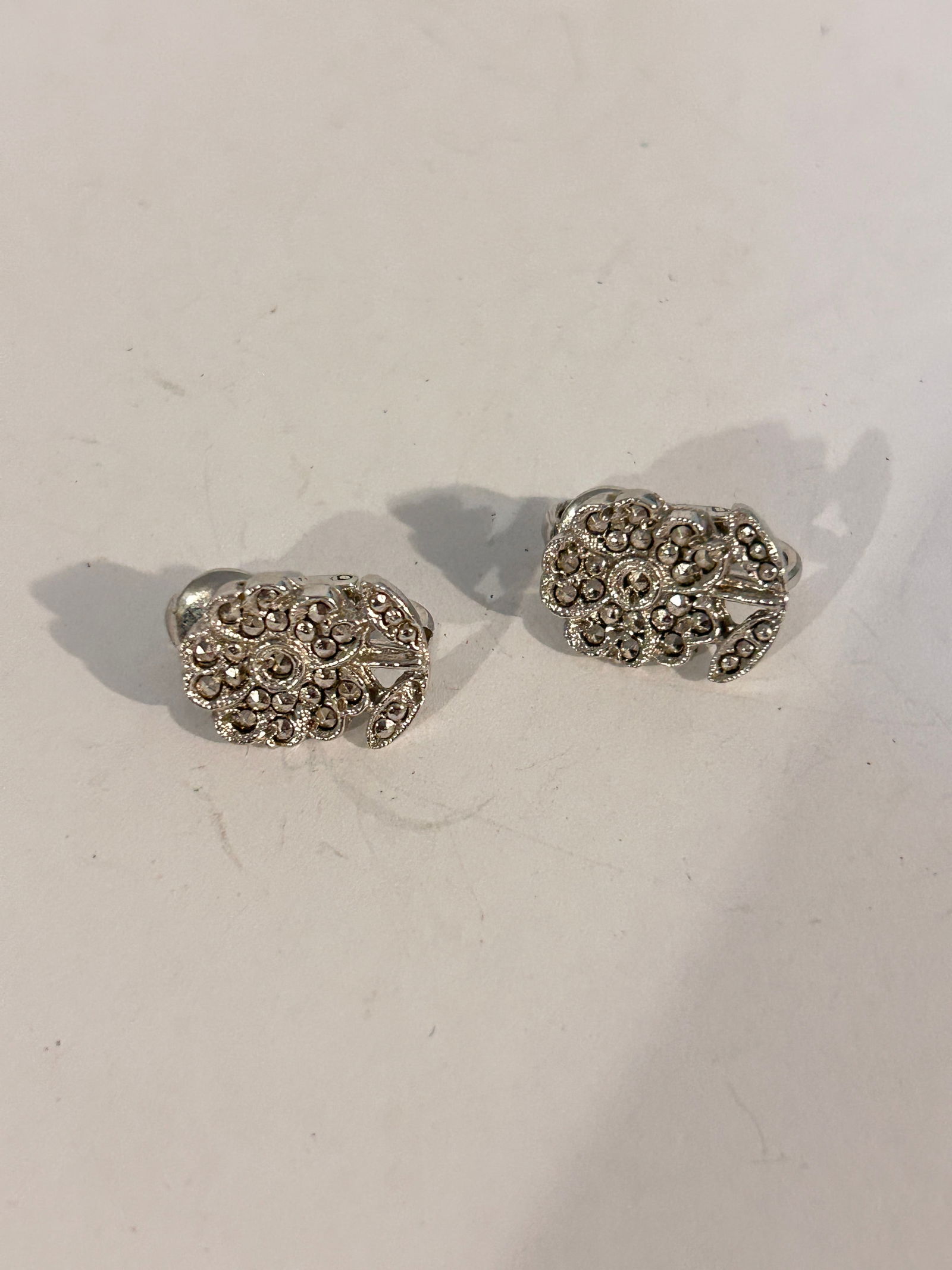 Vintage marcasite floral Earrings: Vintage marcasite floral Earrings Please view all photos as they are part of the description and condition of this Item, Feel free to contact me with questions or picture requests! Used Item AS IS