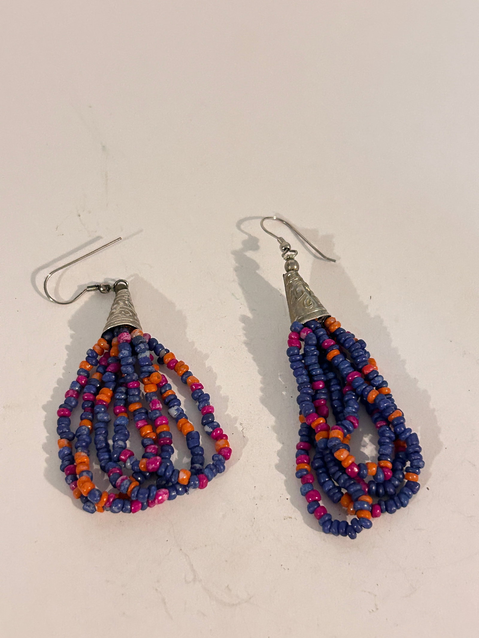 Vintage mini bead 4 strand Earrings: Vintage mini bead 4 strand Earrings Please view all photos as they are part of the description and condition of this Item, Feel free to contact me with questions or picture requests! Used Item AS IS