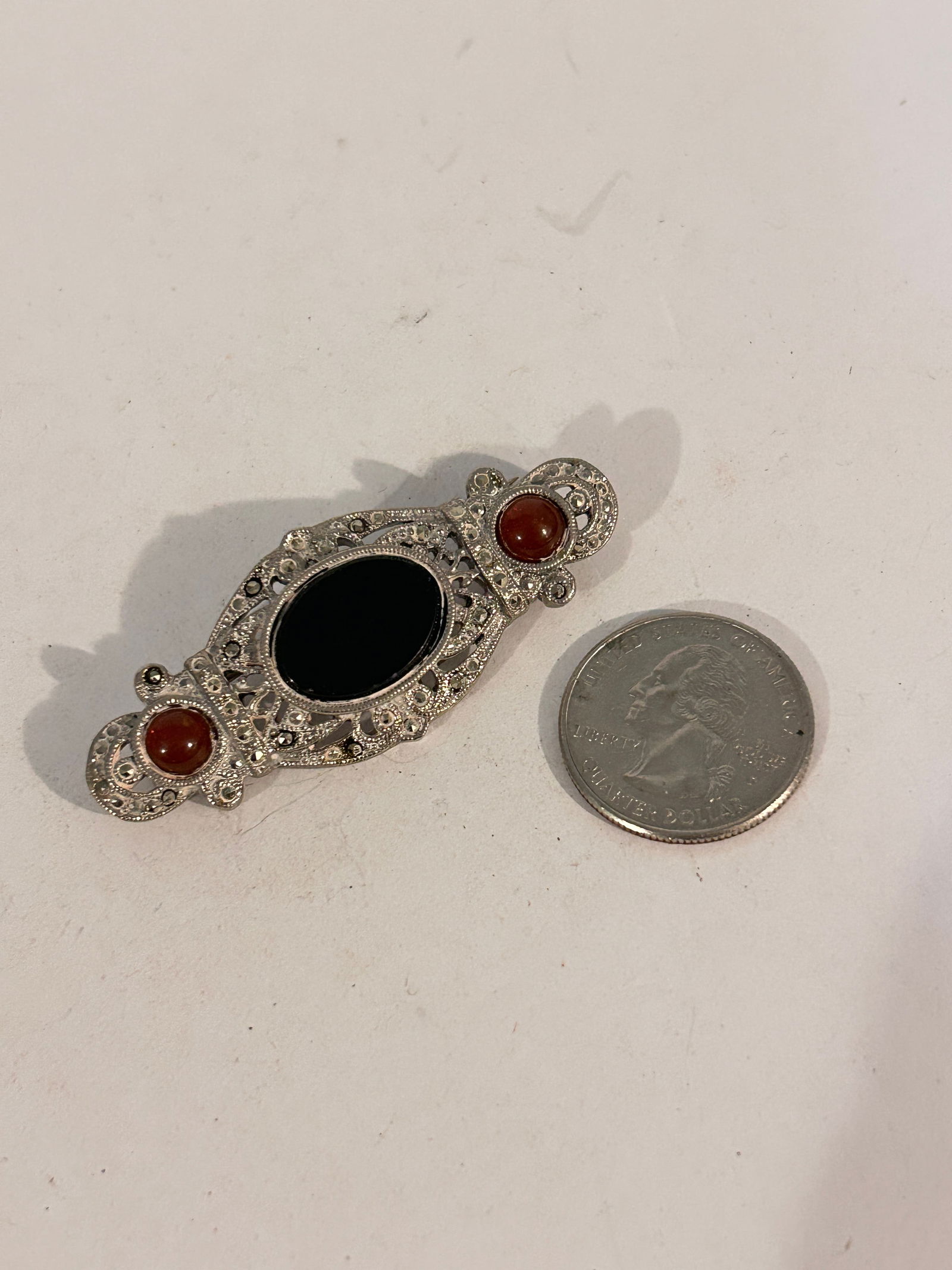 Vintage Marcasite silver tone onyx Brooch: Vintage Marcasite silver tone onyx Brooch Please view all photos as they are part of the description and condition of this Item, Feel free to contact me with questions or picture requests! Used Item A