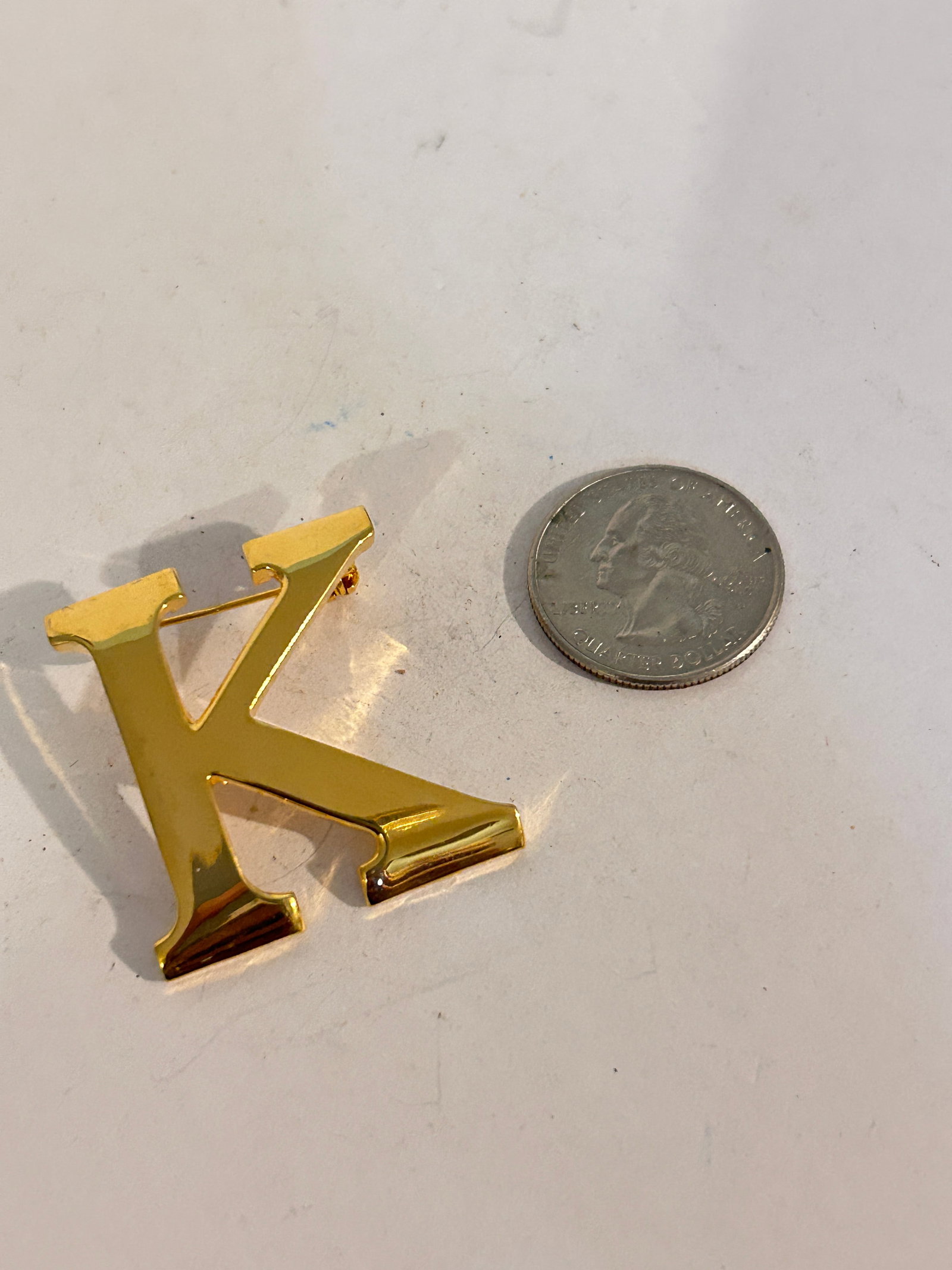 Vintage gold tone K ak Brooch: Vintage gold tone K ak Brooch Please view all photos as they are part of the description and condition of this Item, Feel free to contact me with questions or picture requests! Used Item AS IS