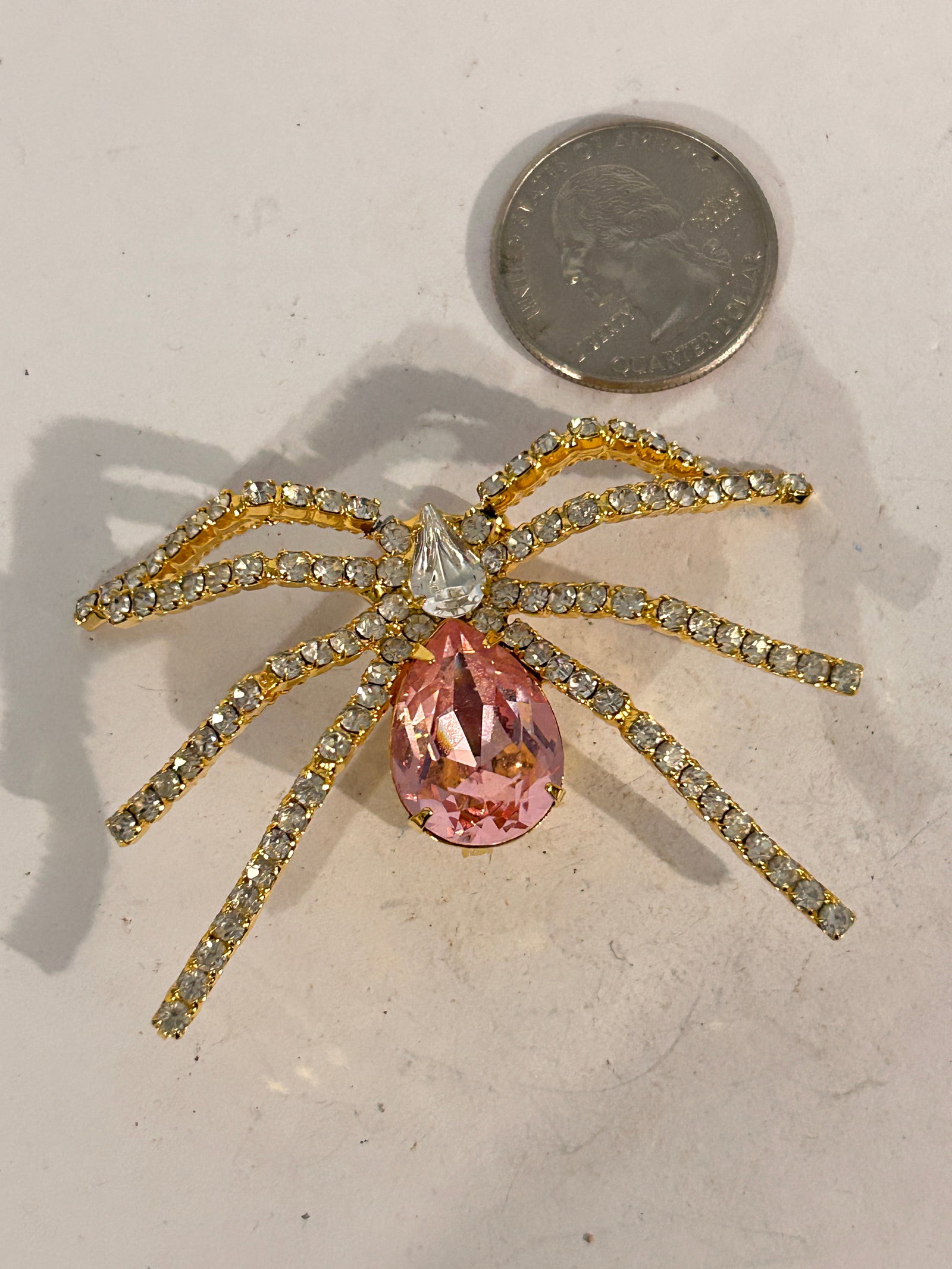 Vintage Rhinestone Goldtone IVANA Spider Brooch: Vintage Rhinestone Goldtone IVANA Spider Brooch Please view all photos as they are part of the description and condition of this Item, Feel free to contact me with questions or picture requests! Used 