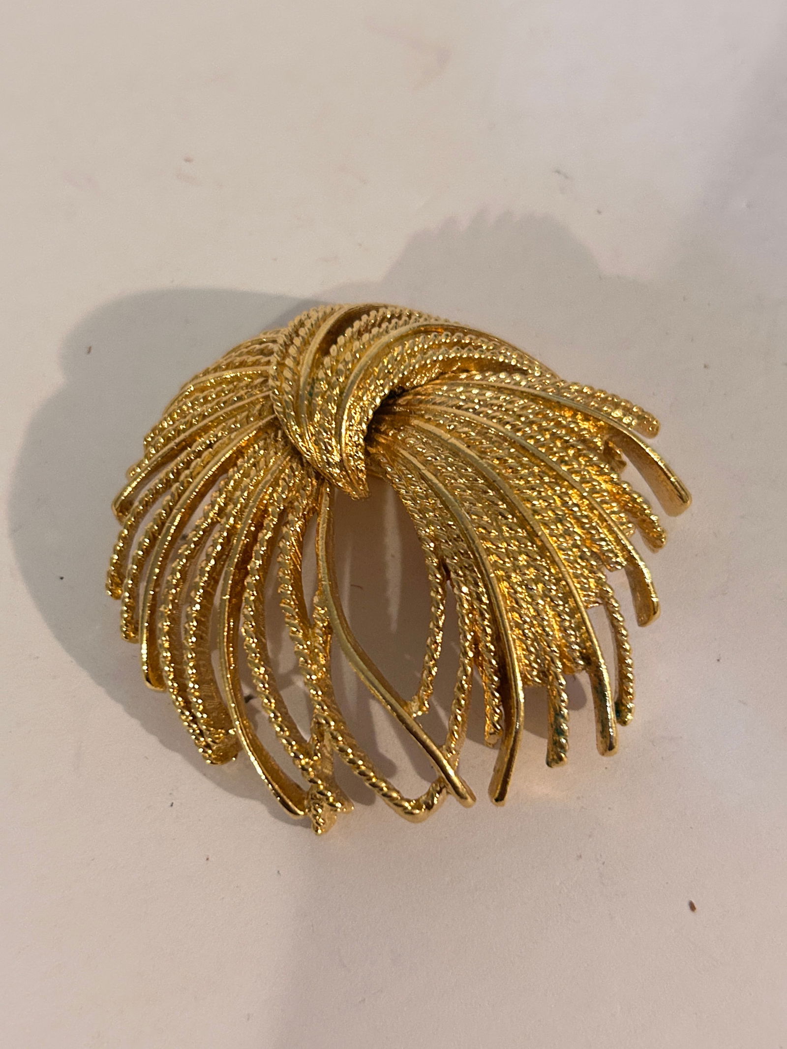 Vintage gold tone monet Brooch: Vintage gold tone monet Brooch Please view all photos as they are part of the description and condition of this Item, Feel free to contact me with questions or picture requests! Used Item AS IS