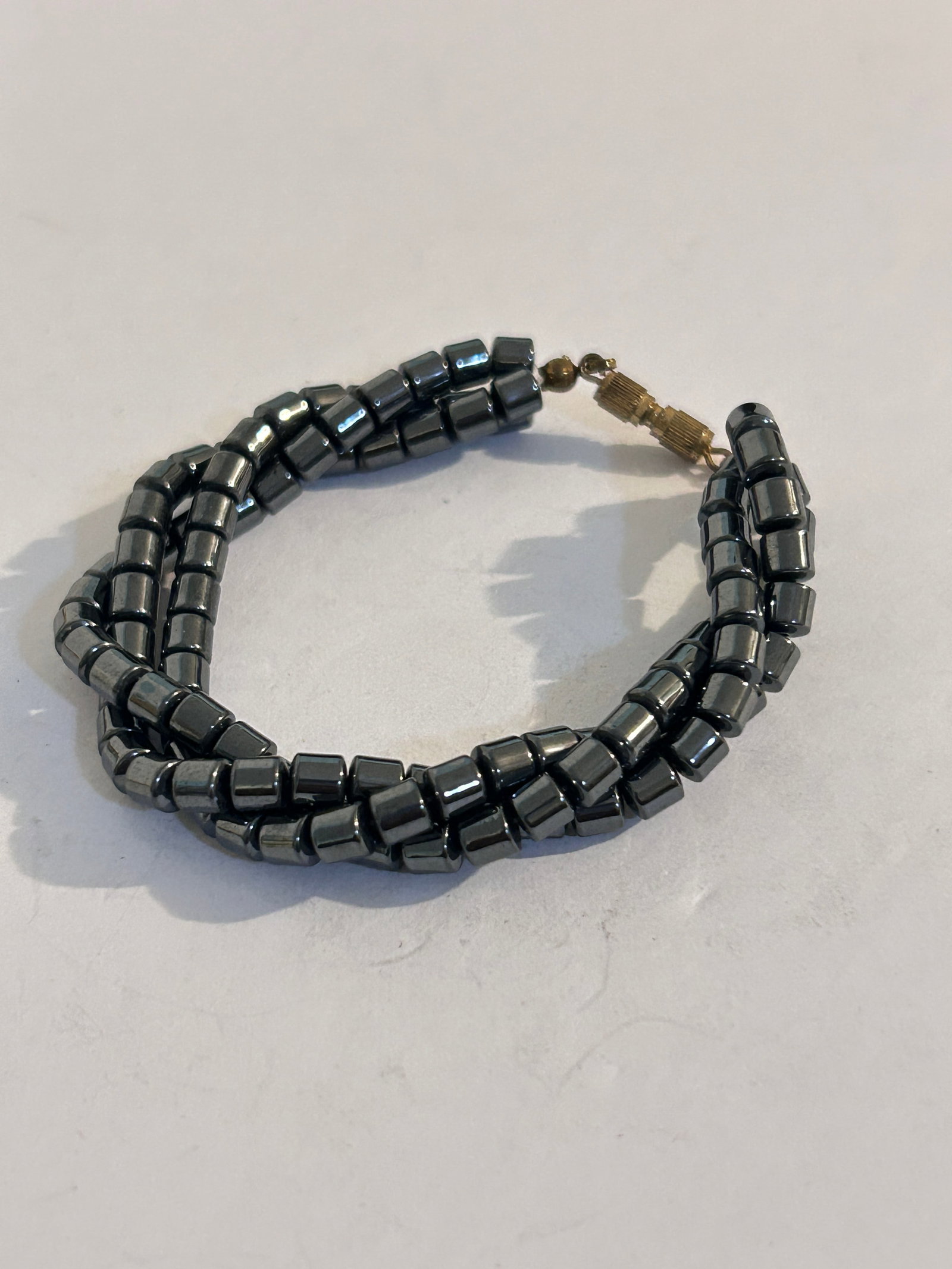 Vintage Hematite/black 3 strand Bracelet Sz 7": Vintage Hematite/black 3 strand Bracelet Sz 7" Please view all photos as they are part of the description and condition of this Item, Feel free to contact me with questions or picture requests! Used I