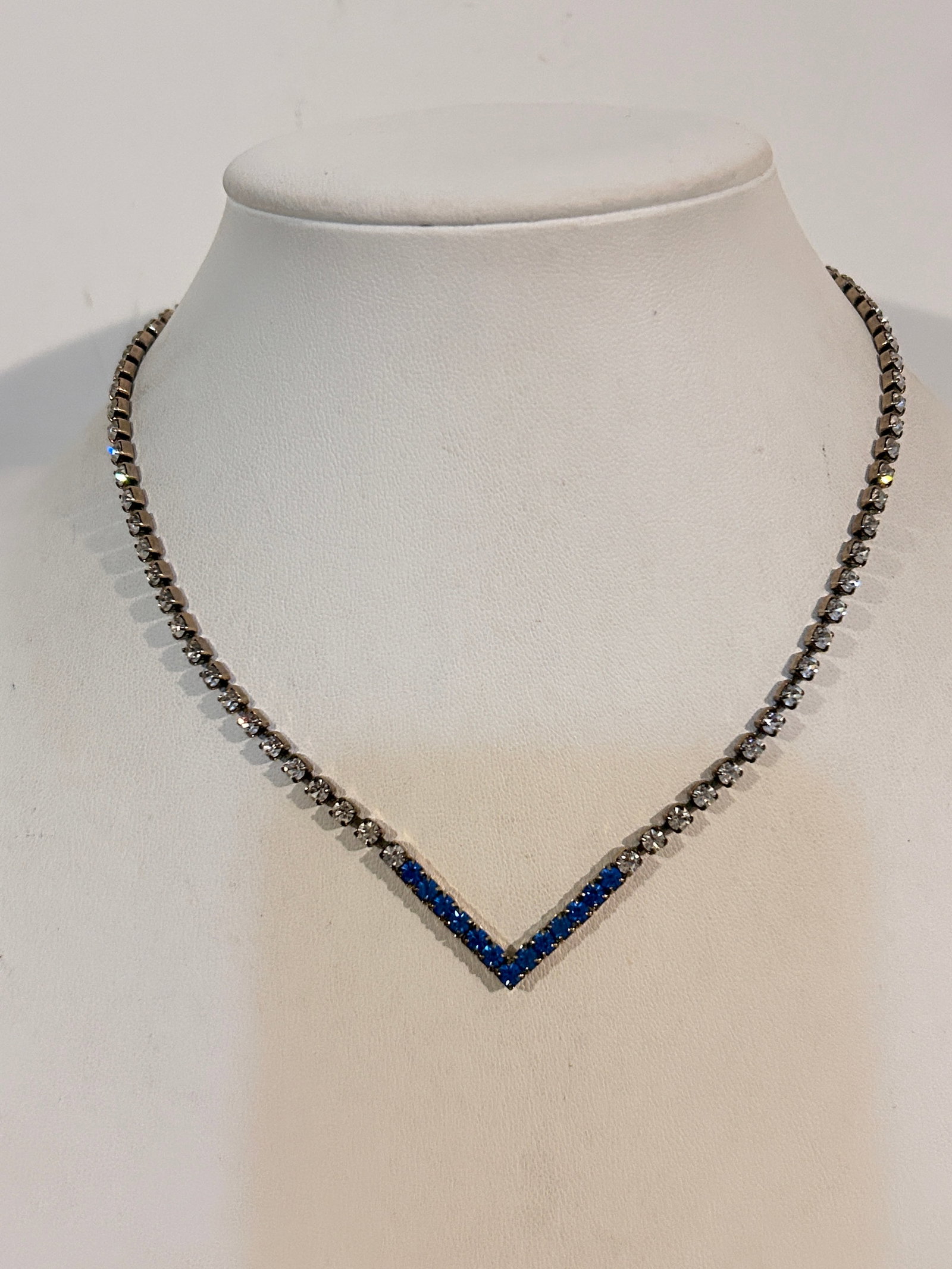 Vintage blue Rhinestone V Necklace 14": Vintage blue Rhinestone V Necklace 14" Please view all photos as they are part of the description and condition of this Item, Feel free to contact me with questions or picture requests! Used Item AS I