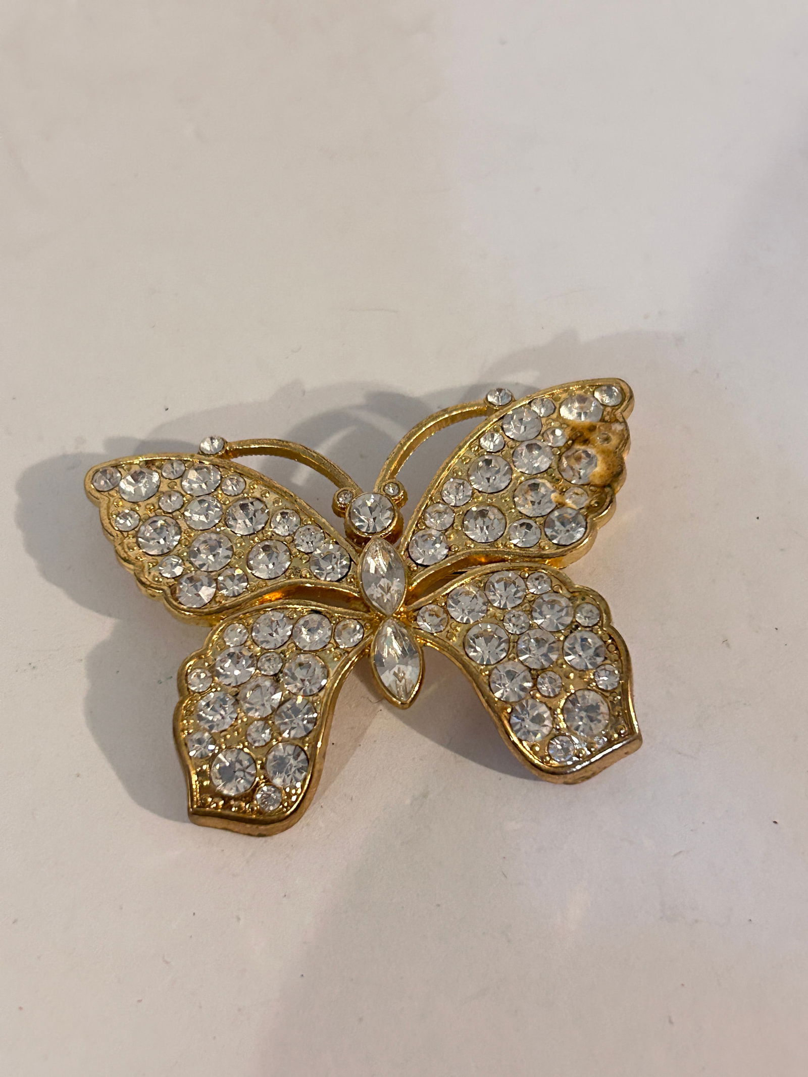 Vintage Gold tone Rhinestone Monet butterfly Brooch: Vintage Gold tone Rhinestone Monet butterfly Brooch Please view all photos as they are part of the description and condition of this Item, Feel free to contact me with questions or picture requests! U