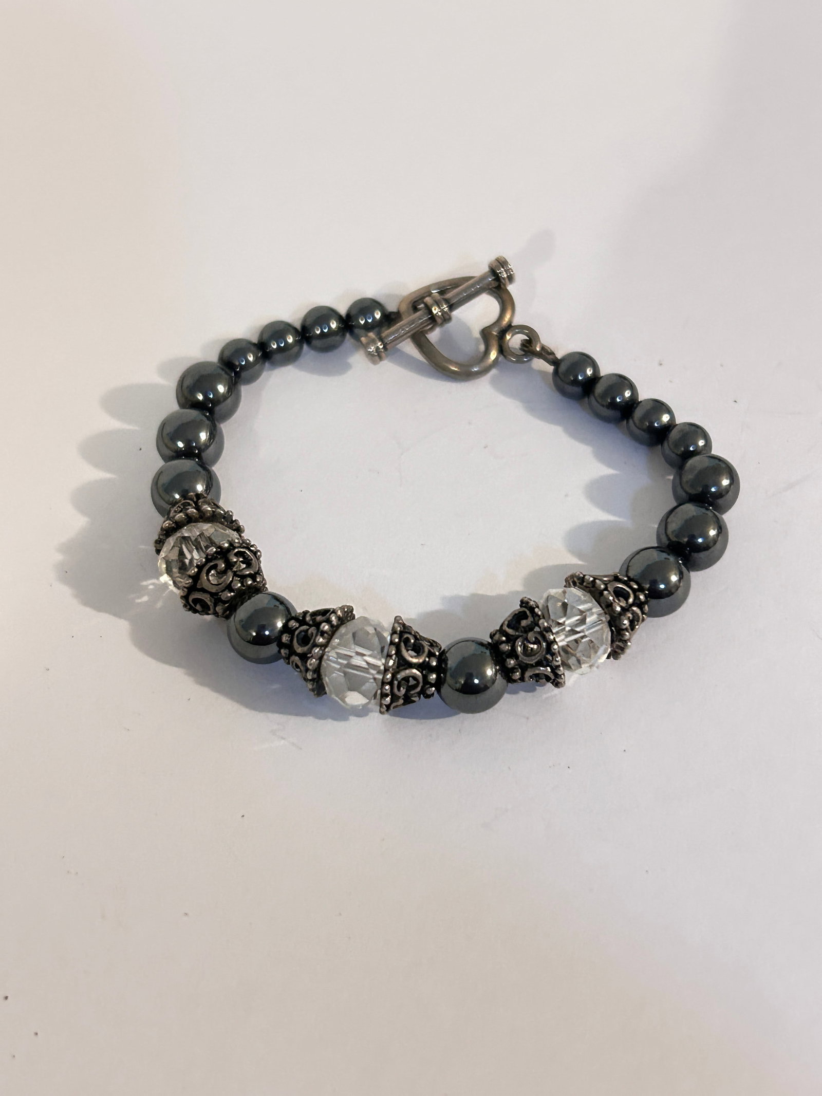Vintage Hematite Crystal heart Bracelet 7": Vintage Hematite Crystal heart Bracelet 7" Please view all photos as they are part of the description and condition of this Item, Feel free to contact me with questions or picture requests! Used Item