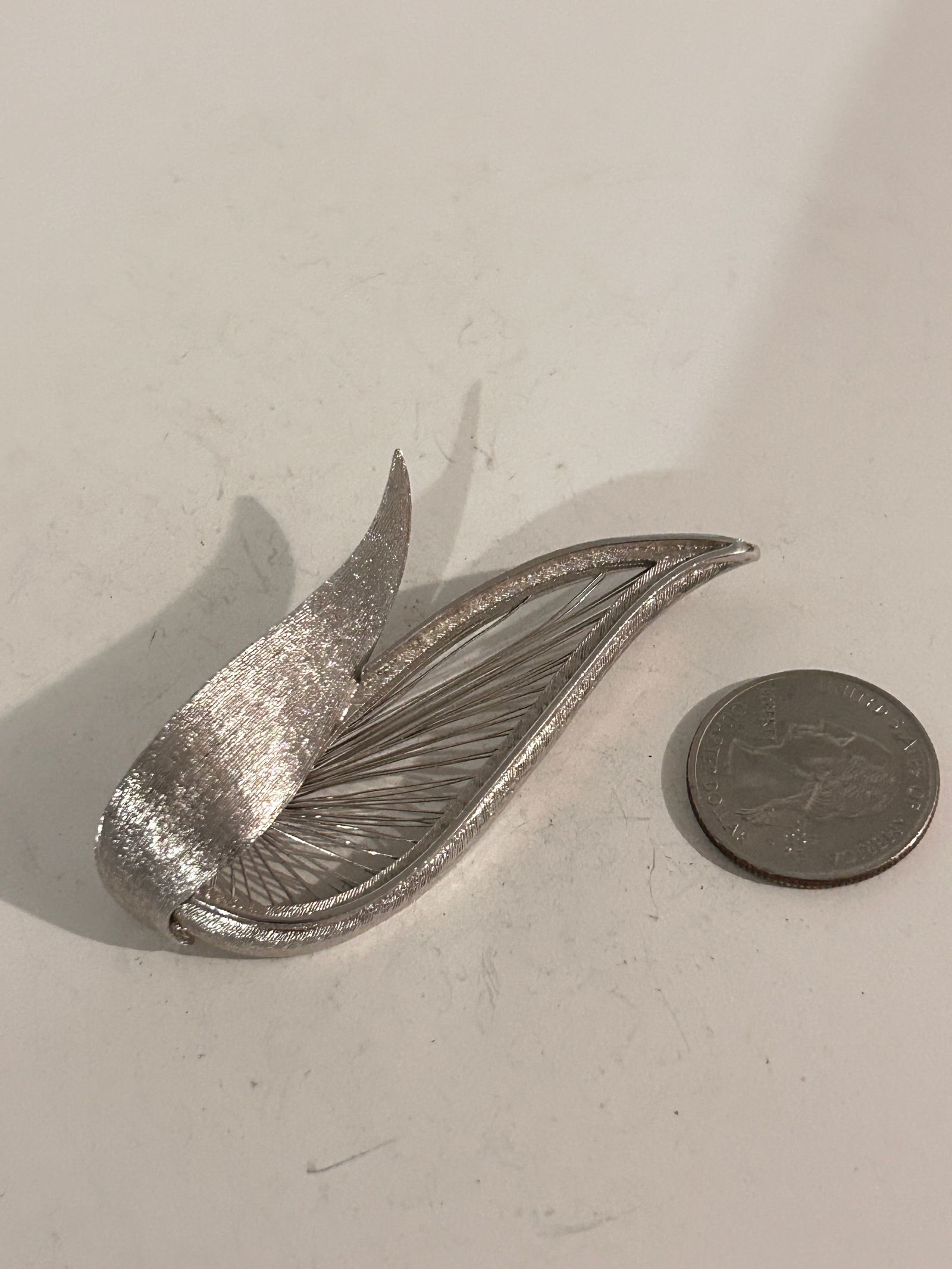 Vintage Silver Tone Monet Brooch: Vintage Silver Tone Monet Brooch Please view all photos as they are part of the description and condition of this Item, Feel free to contact me with questions or picture requests! Used Item AS IS