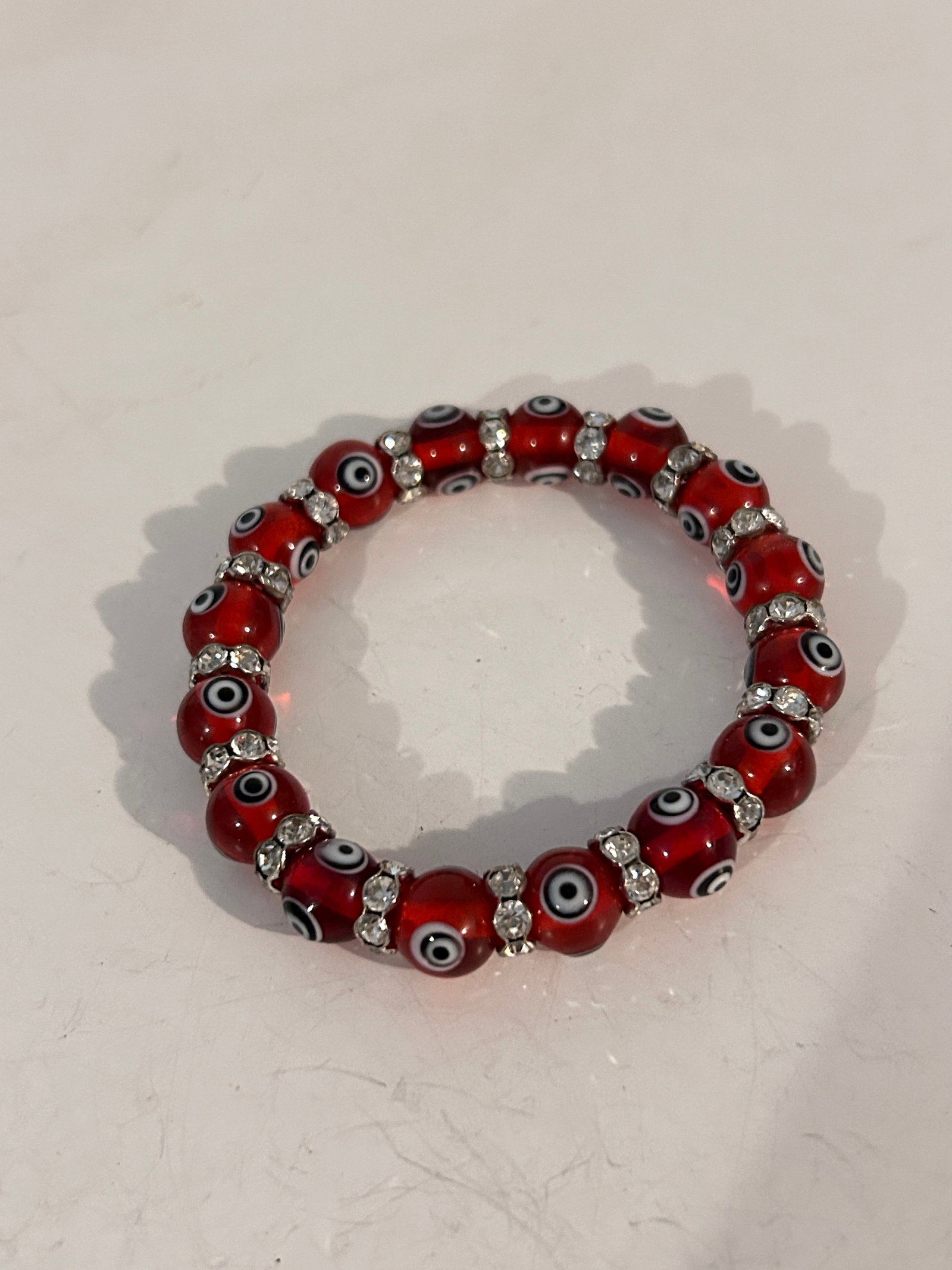 Vintage red glass evil eye stretch Bracelet Sz 8": Vintage red glass evil eye stretch Bracelet Sz 8" Please view all photos as they are part of the description and condition of this Item, Feel free to contact me with questions or picture requests! Use