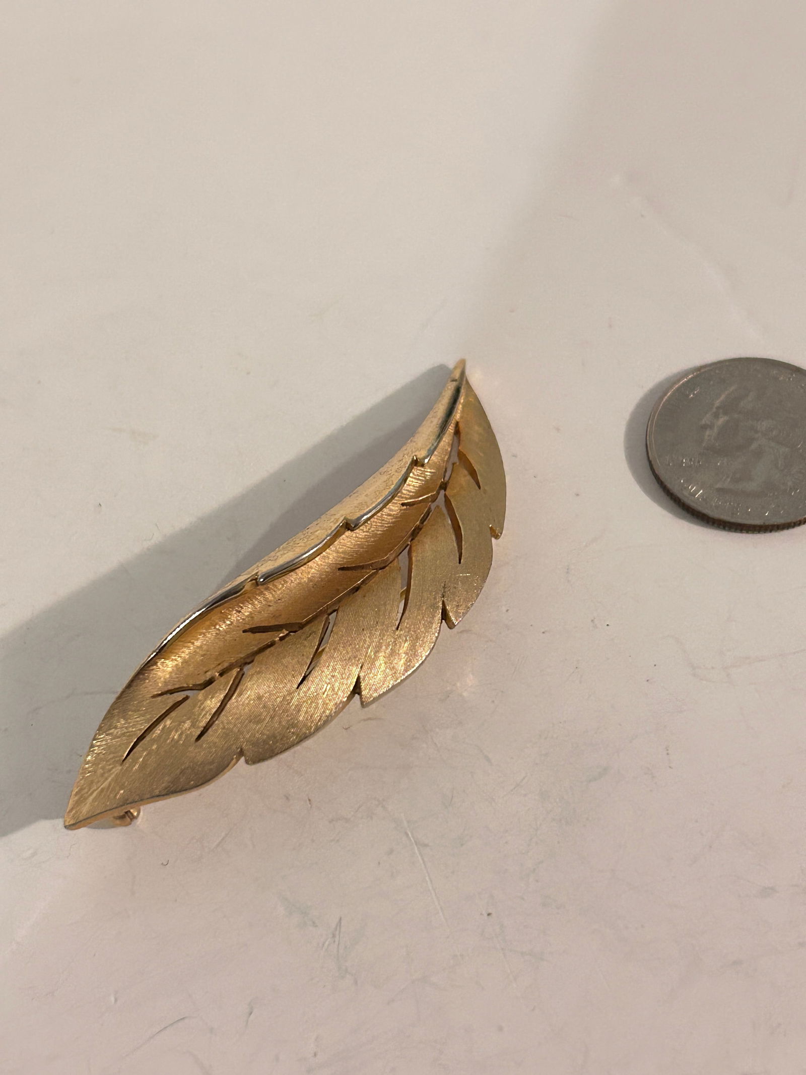 Vintage gold tone Trifari leaf Brooch: Vintage gold tone Trifari leaf Brooch Please view all photos as they are part of the description and condition of this Item, Feel free to contact me with questions or picture requests! Used Item AS IS
