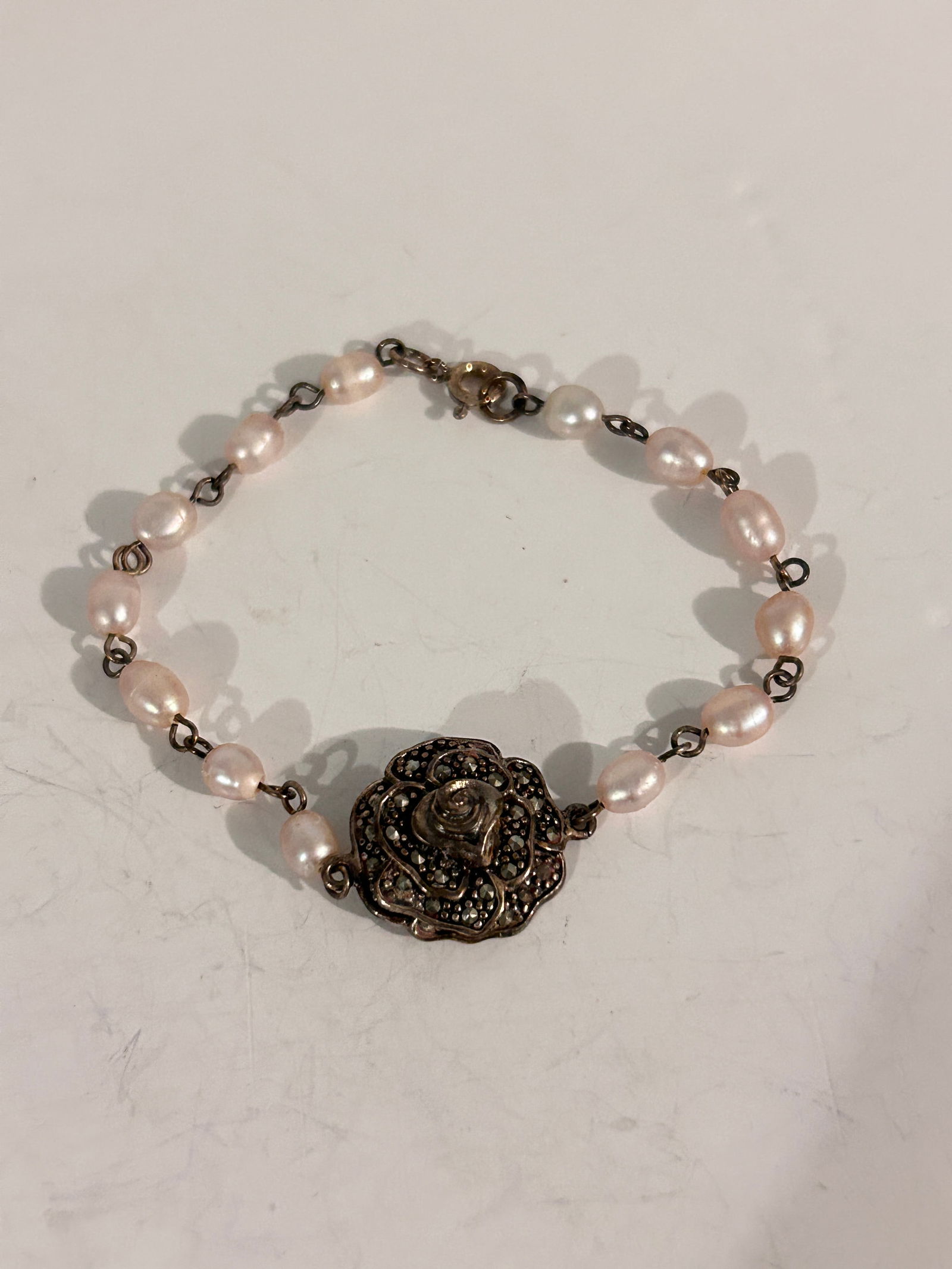 Vintage Sterling Silver Pearl marcasite floral Bracelet 7": Vintage Sterling Silver Pearl marcasite floral Bracelet 7" Please view all photos as they are part of the description and condition of this Item, Feel free to contact me with questions or picture requ