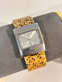 Geneva Silver Tone Cheetah Pattern Band Women’s Cuff Watch working
