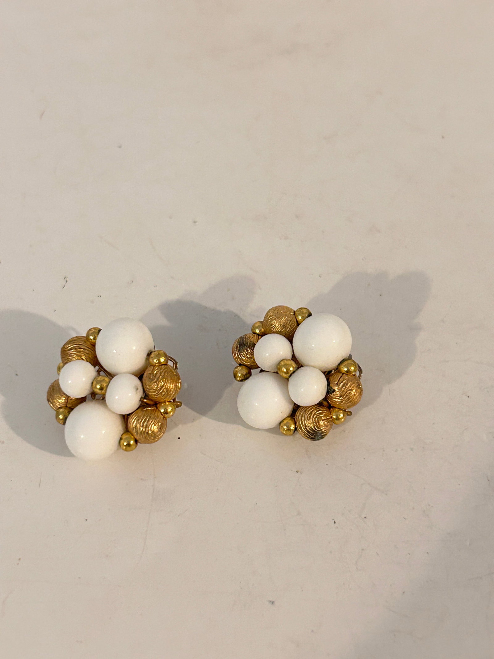 Vintage milk glass bead Earrings: Vintage milk glass bead Earrings Please view all photos as they are part of the description and condition of this Item, Feel free to contact me with questions or picture requests! Used Item AS IS