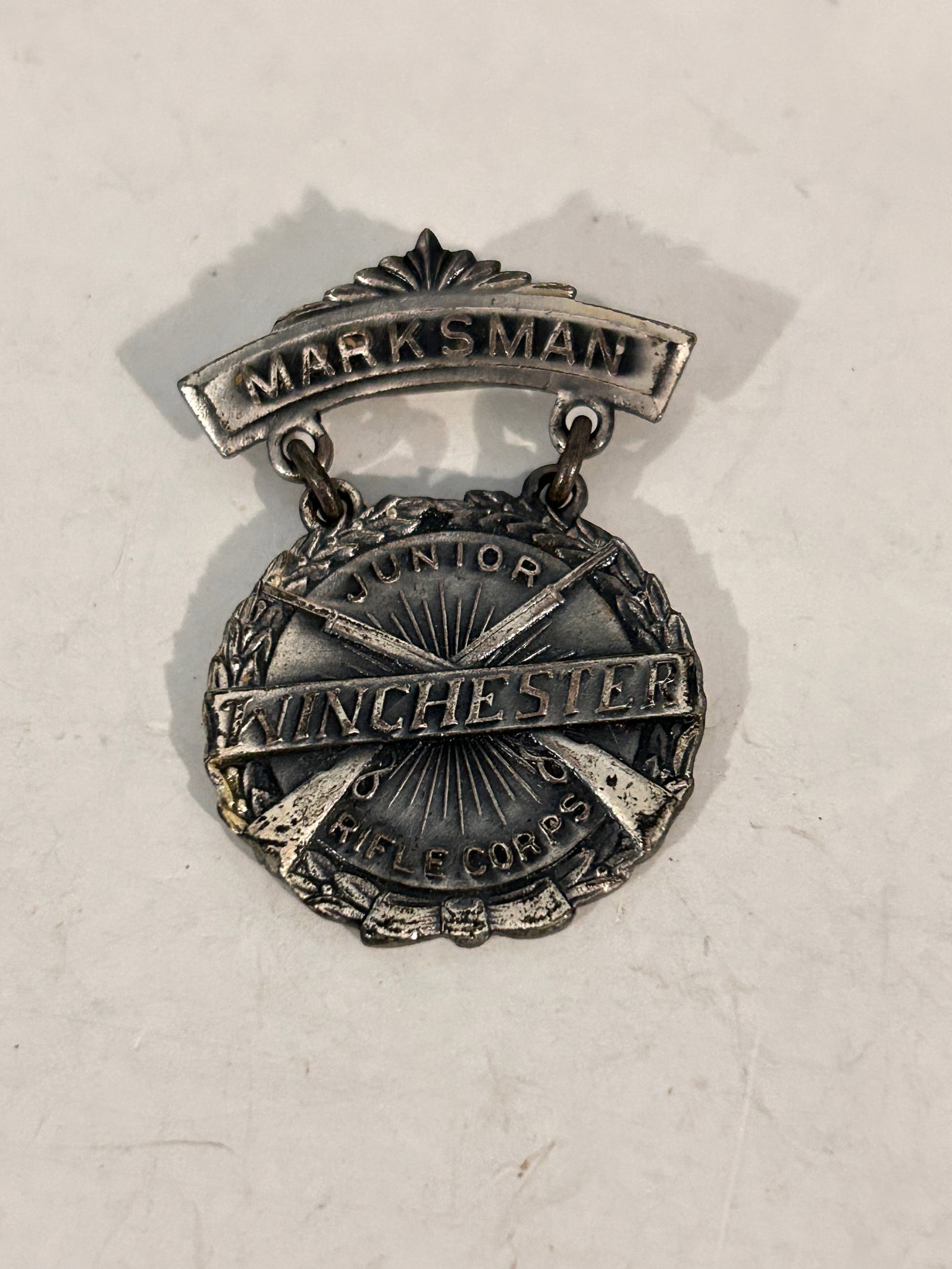 Vintage 1920s Winchester Junior Rifle Corps PRO MARKSMAN Badge Silver: Vintage 1920s Winchester Junior Rifle Corps PRO MARKSMAN Badge Silver Please view all photos as they are part of the description and condition of this Item, Feel free to contact me with questions or p