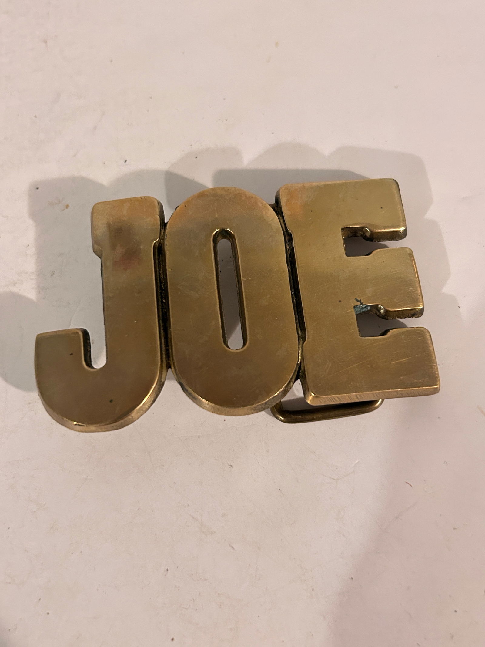 Vintage JOE Brass Belt Buckle: Vintage JOE Brass Belt Buckle Please view all photos as they are part of the description and condition of this Item, Feel free to contact me with questions or picture requests! Used Item AS IS