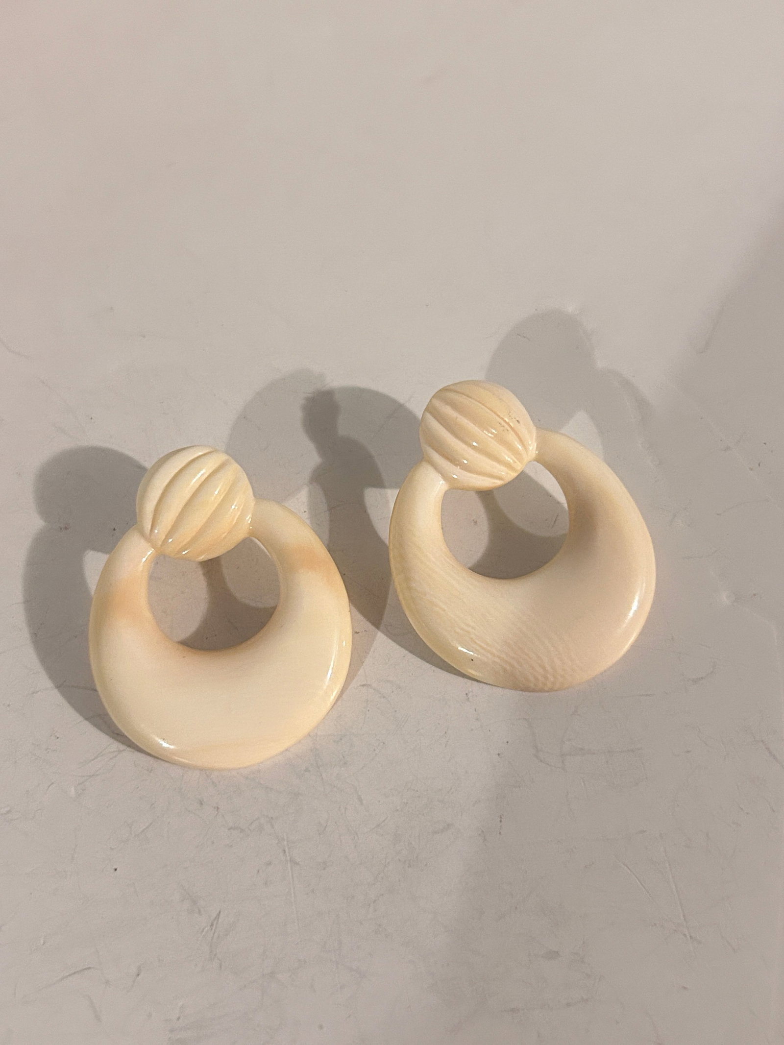 Vintage white Acrylic Earrings: Item comes exactly as shown Know what you are bidding on. Carefully refer to and examine all photos, ask questions, do research, etc., to determine (Authinticity) . before bidding in order to determin