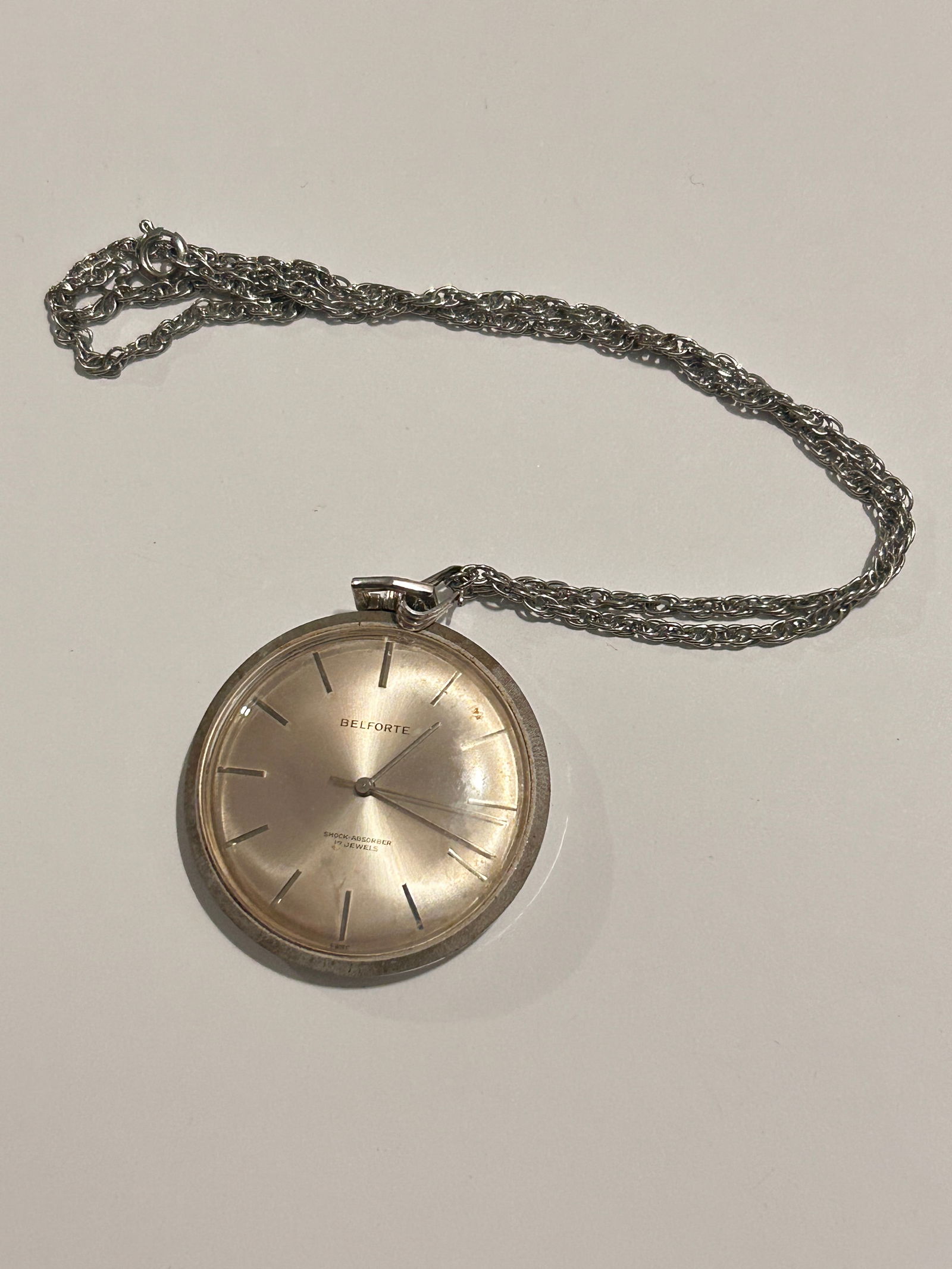 Vintage Gold Tone BELFORTE 17 Jewel pocket watch working has engraving on back: Vintage Gold Tone BELFORTE 17 Jewel pocket watch working has engraving on back Please view all photos as they are part of the description and condition of this Item, Feel free to contact me with quest