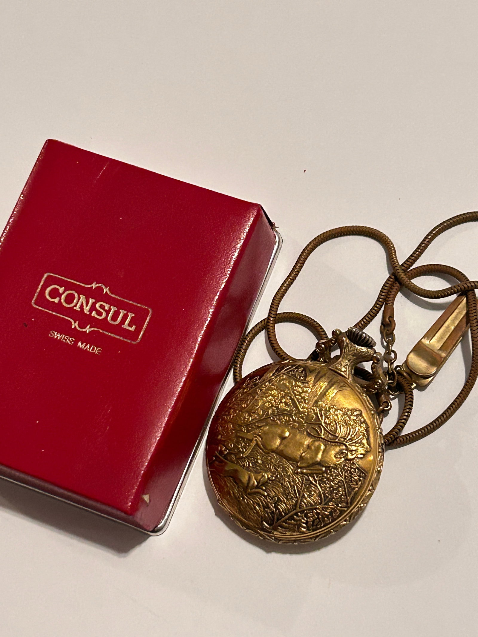 Vintg Consul 17 jewel Swiss made brass gold tone pocket watch: Vintg Consul 17 jewel Swiss made brass gold tone pocket watch Please view all photos as they are part of the description and condition of this Item, Feel free to contact me with questions or picture r