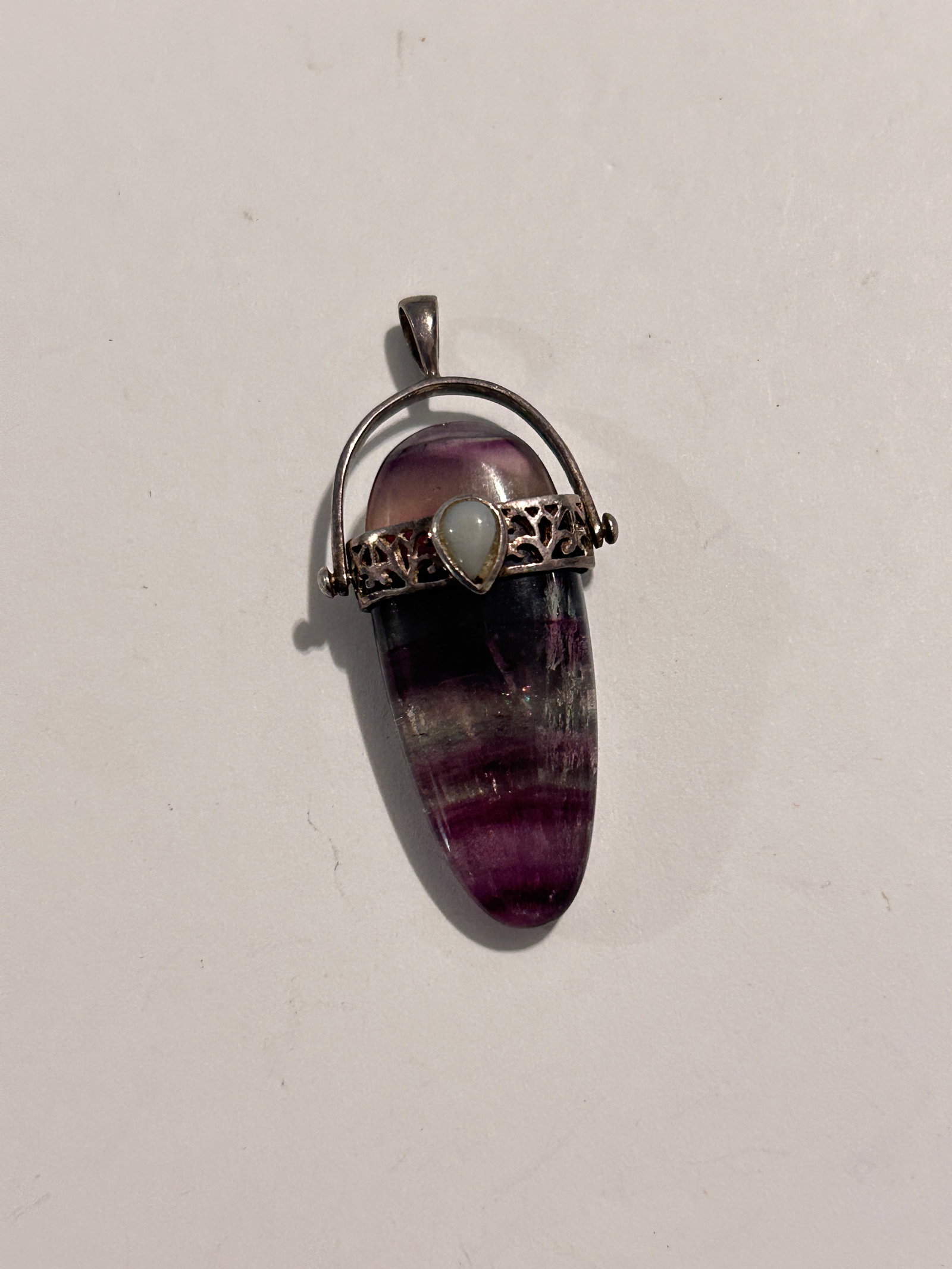 Purple Banded Fluorite with Opal Pendant: Purple Banded Fluorite with Opal Pendant Please view all photos as they are part of the description and condition of this Item, Feel free to contact me with questions or picture requests! Used Item AS