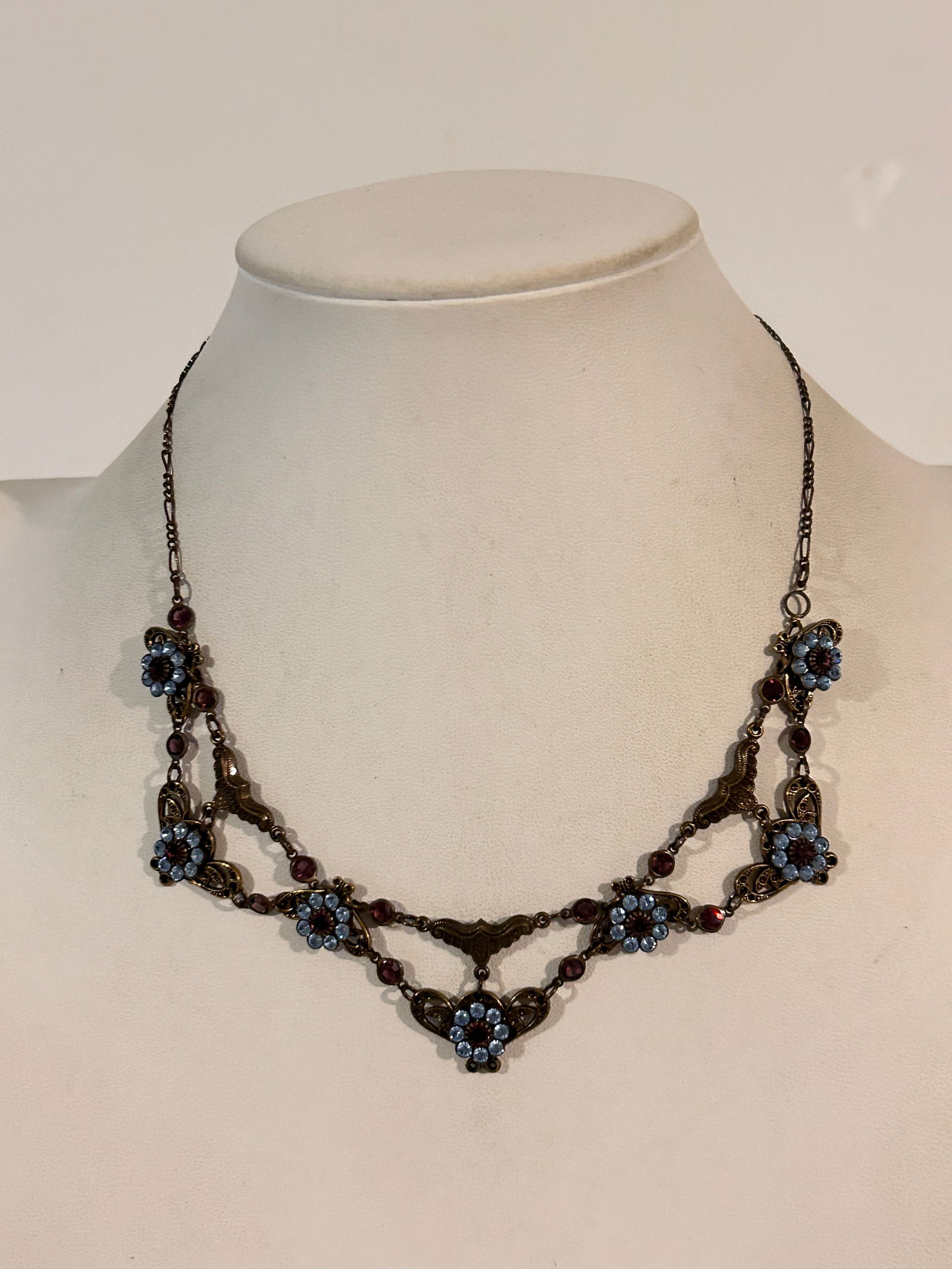 Vintage Kenny Ma San Francisco vintage-inspired necklace featuring blue enamel flowers and Swarovski: Vintage Kenny Ma San Francisco vintage-inspired necklace featuring blue enamel flowers and Swarovski crystals set in an antiqued brass-tone metal 14" Please view all photos as they are part of the des