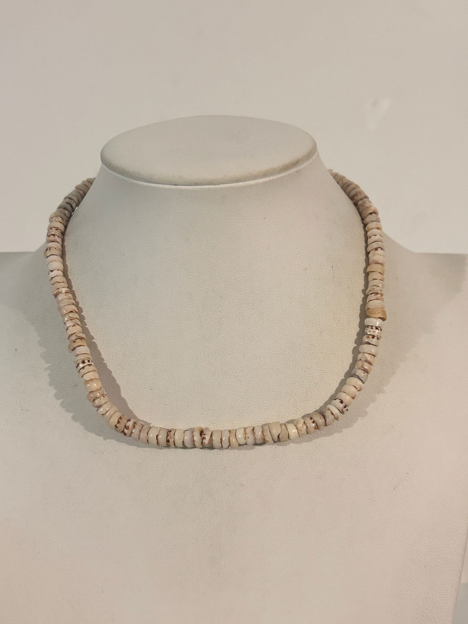 Hawaiian-style puka shell necklace, typically made from natural, small, white shells 15" (1 of 5)