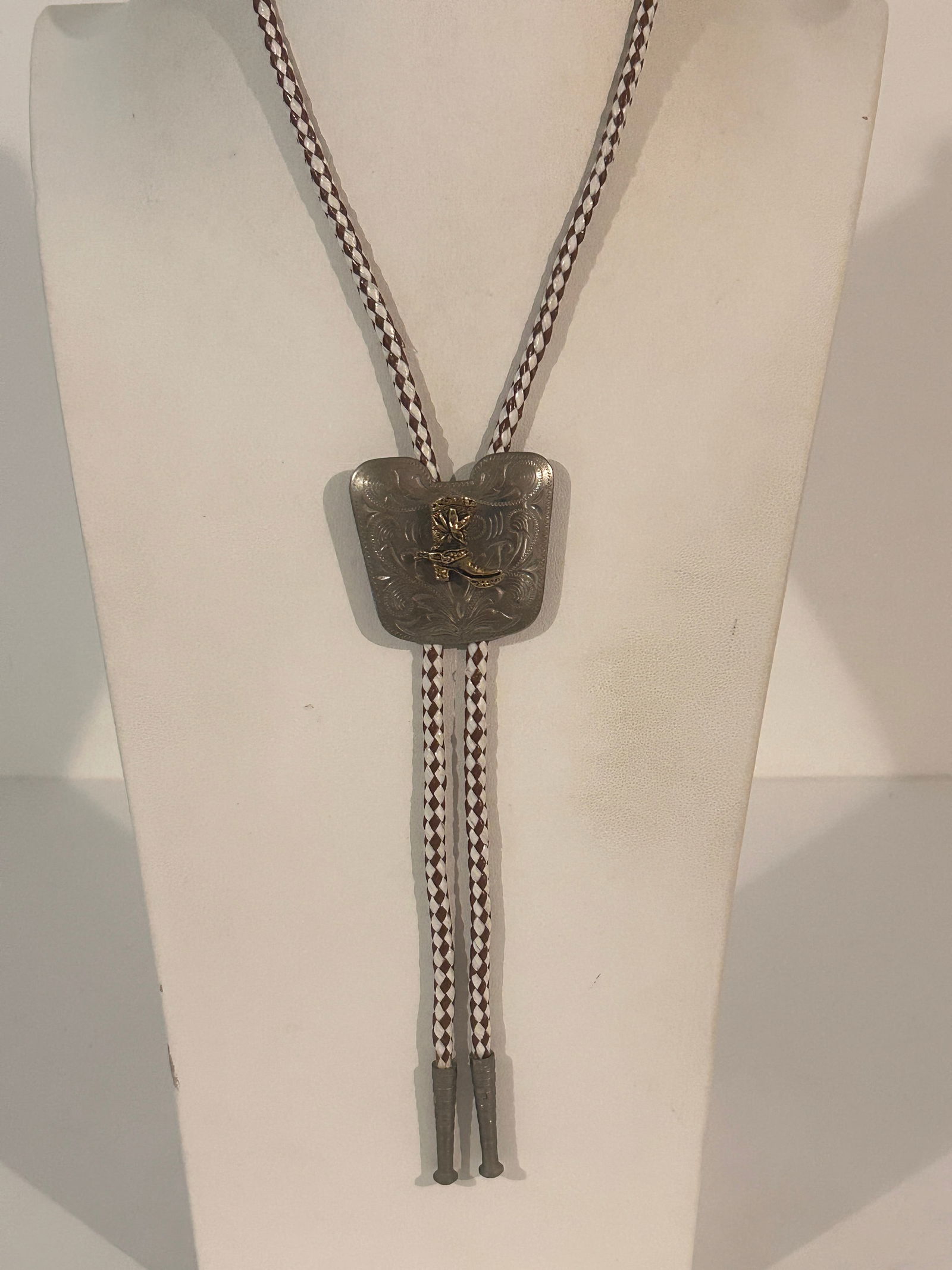 vintage metal bolo tie with a silver-toned slide featuring a brass- or gold-toned cowboy boot and (1 of 5)