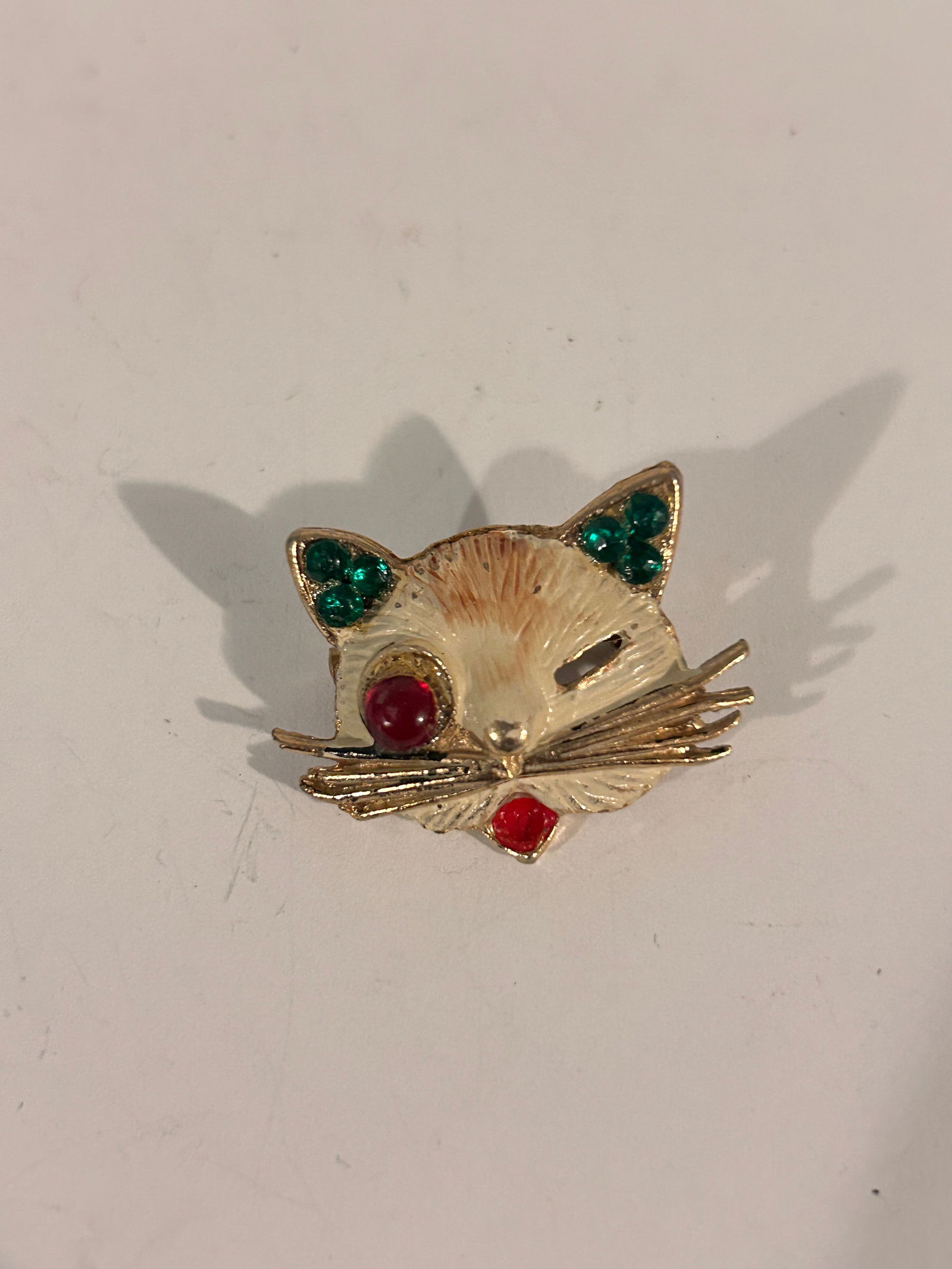 Vintage 1960s Dodds gold-tone cat brooch with green rhinestone ears, a red rhinestone eye (1 of 4)
