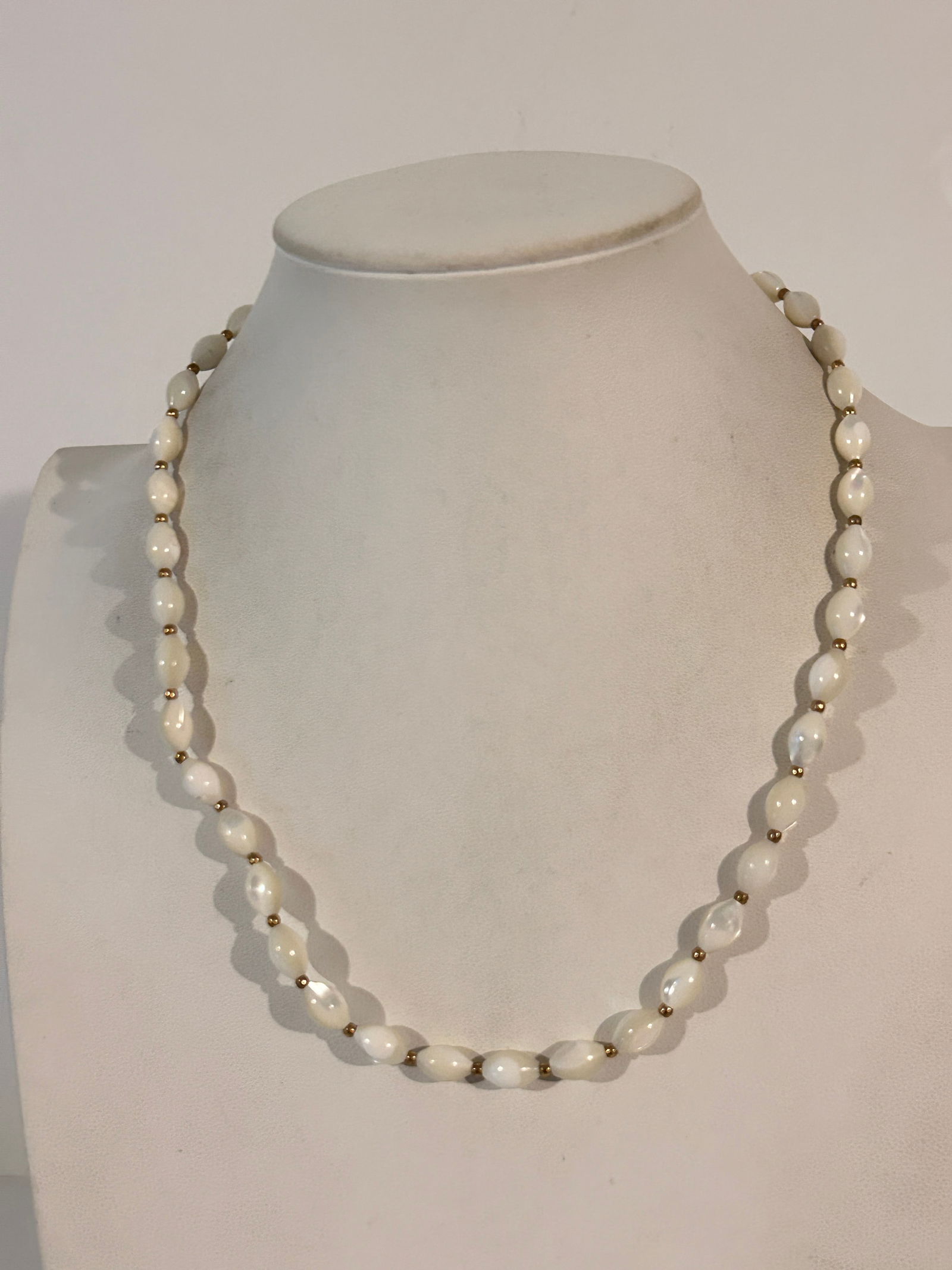 Vintage-inspired white glass oval beaded necklace with a gold-tone barrel clasp closure 18": Vintage-inspired white glass oval beaded necklace with a gold-tone barrel clasp closure 18" Please view all photos as they are part of the description and condition of this Item, Feel free to contact