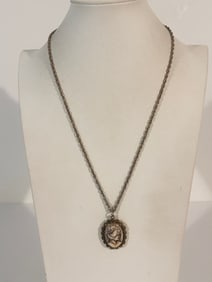 Vintage-style cameo necklace featuring a raised resin profile of a Victorian woman in an ornate