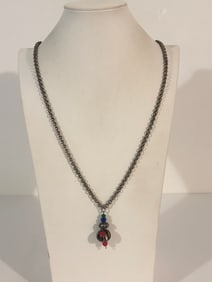 Vintage necklace with a metal chain and a multi-colored glass bead pendant 31"