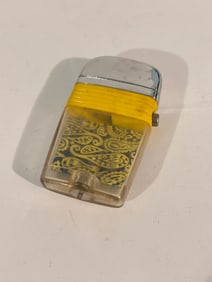 You are looking at a yellow banded Scripto lighter. This lighter is in good condition, However it is
