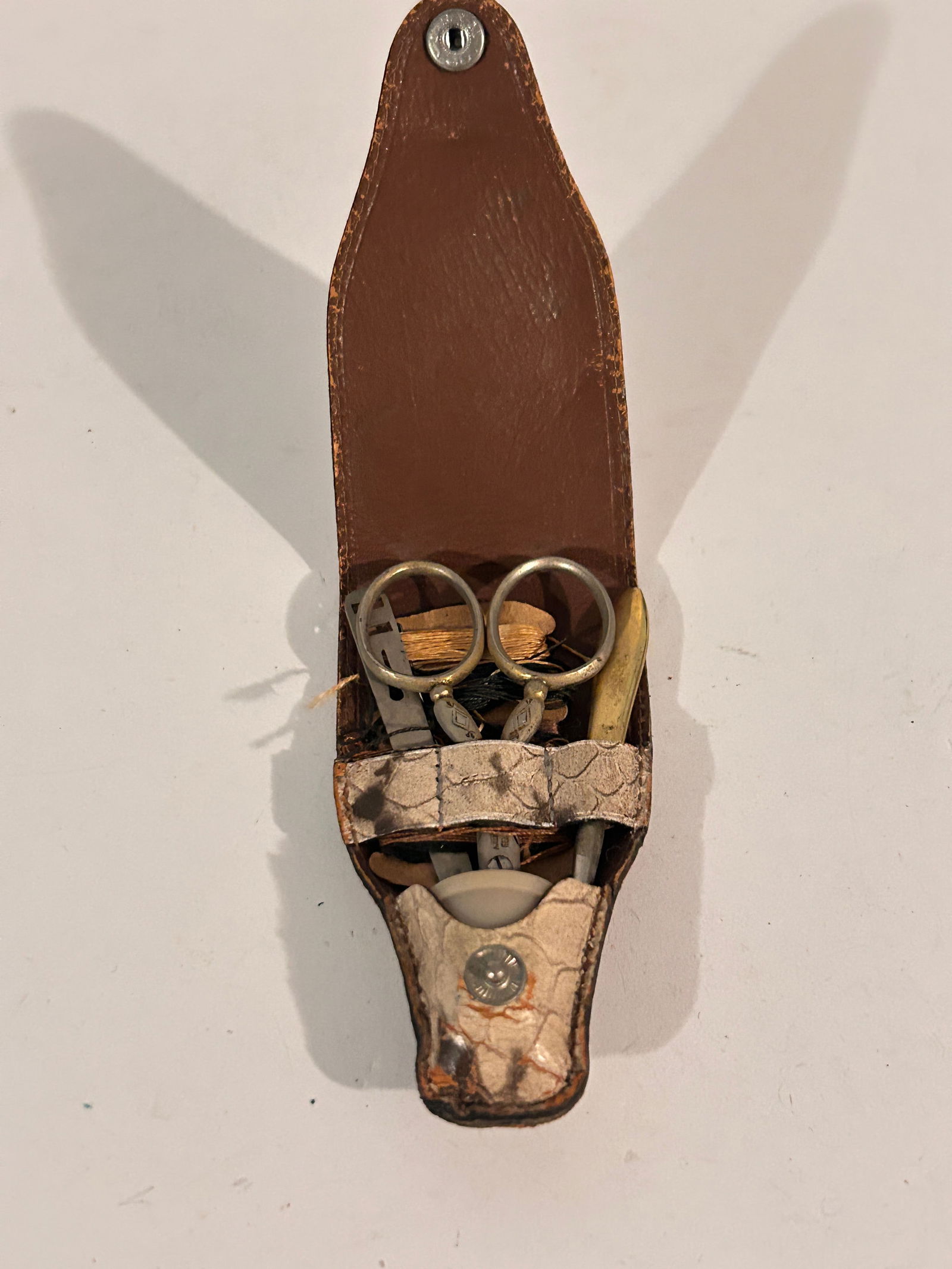 vintage-style personal grooming or manicure kit in a leather pouch, possibly a travel set (1 of 4)