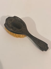 antique Art Nouveau-style hairbrush.