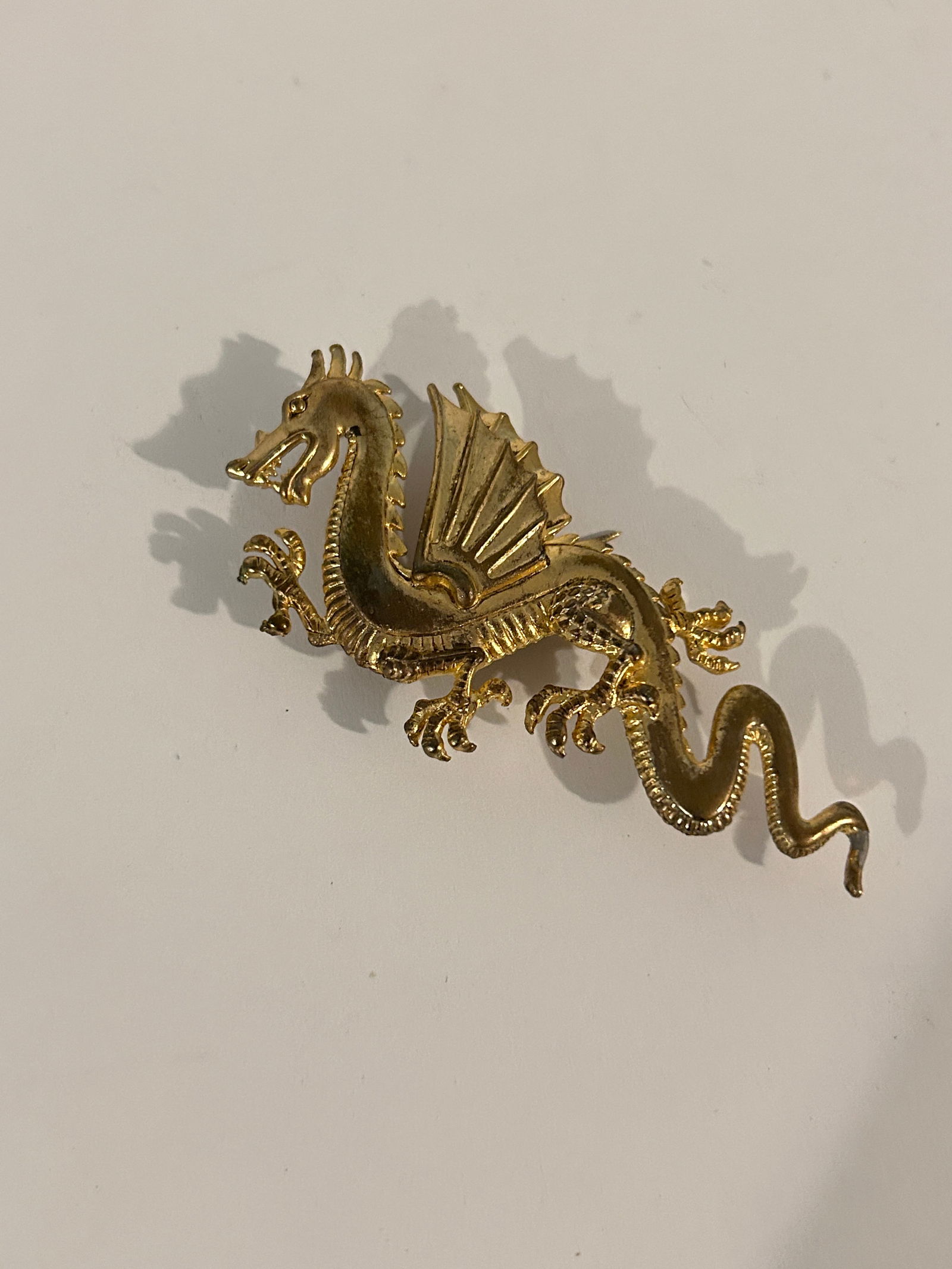 Vintage brass dragon Brooch: Vintage brass dragon Brooch Please view all photos as they are part of the description and condition of this Item, Feel free to contact me with questions or picture requests! Used Item AS IS