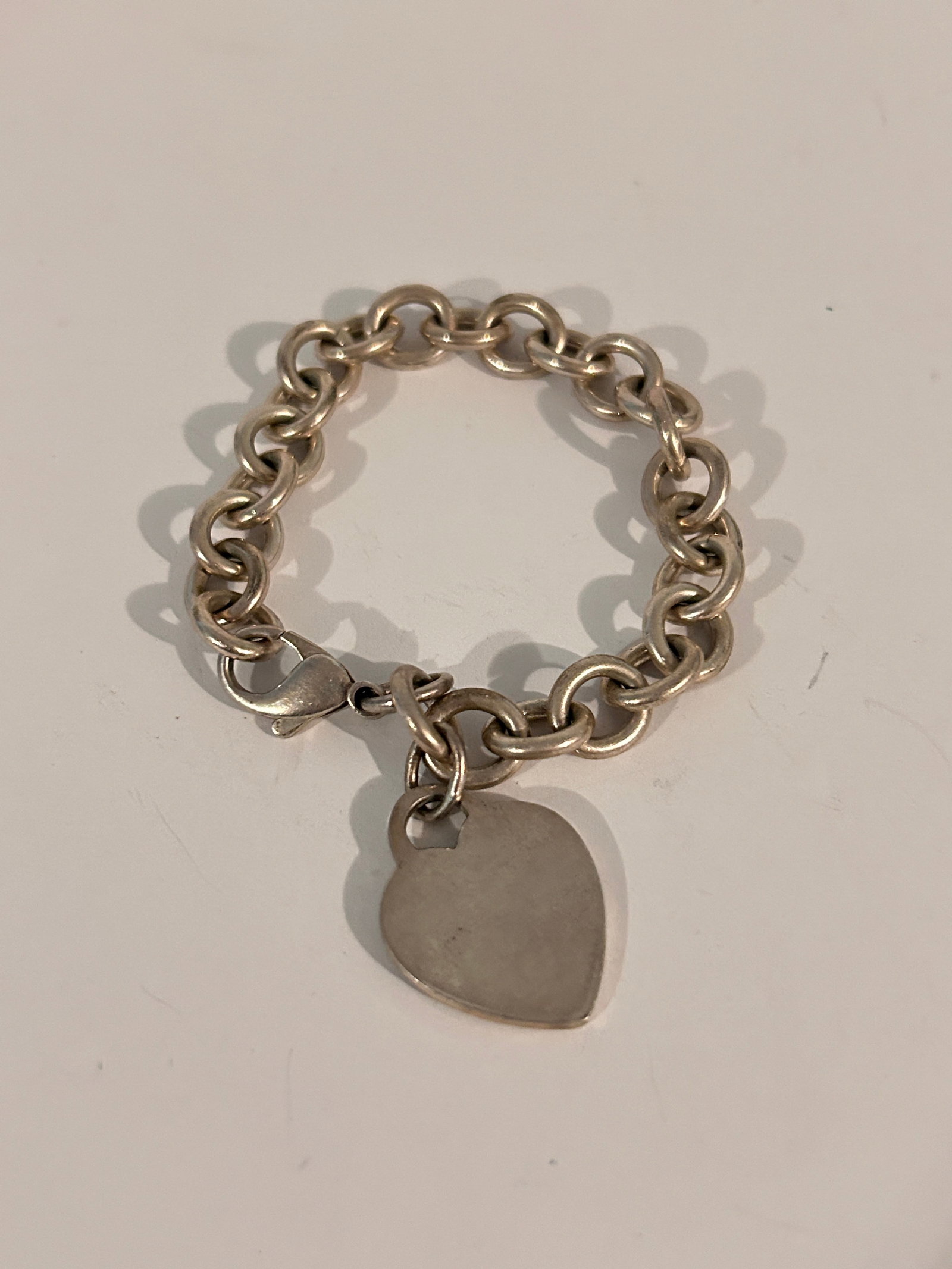 Tiffany & Co. Sterling Silver Heart Tag Charm Bracelet 7": Tiffany & Co. Sterling Silver Heart Tag Charm Bracelet 7" Please view all photos as they are part of the description and condition of this Item, Feel free to contact me with questions or picture reque